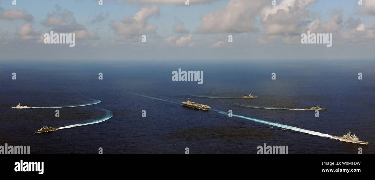 Aircraft carrier USS Harry S. Truman (CVN 75) conduct an emergency break away drill with guided-missile cruiser USS Hue City (CG 66), BNS Liberal (F43) of Brazil, HNLMS Van Speijk (F828) and HNLMS Tromp (F803) of the Netherlands and HMCS Fredricton (FFG 337) of Canada on the Atlantic Ocean on September 19, 2009. UPI/Matthew D. Williams/U.S. Navy Stock Photo