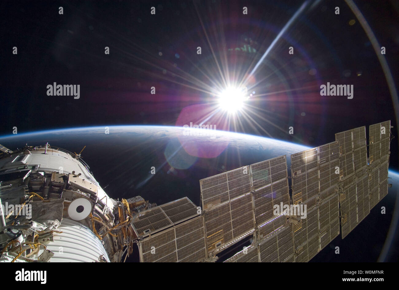 This NASA photo taken by STS-129 crew members aboard the International Space Station shows the Sun as hits the Station as it rises over Earth's horizon, November 22, 2009.    UPI/NASA Stock Photo