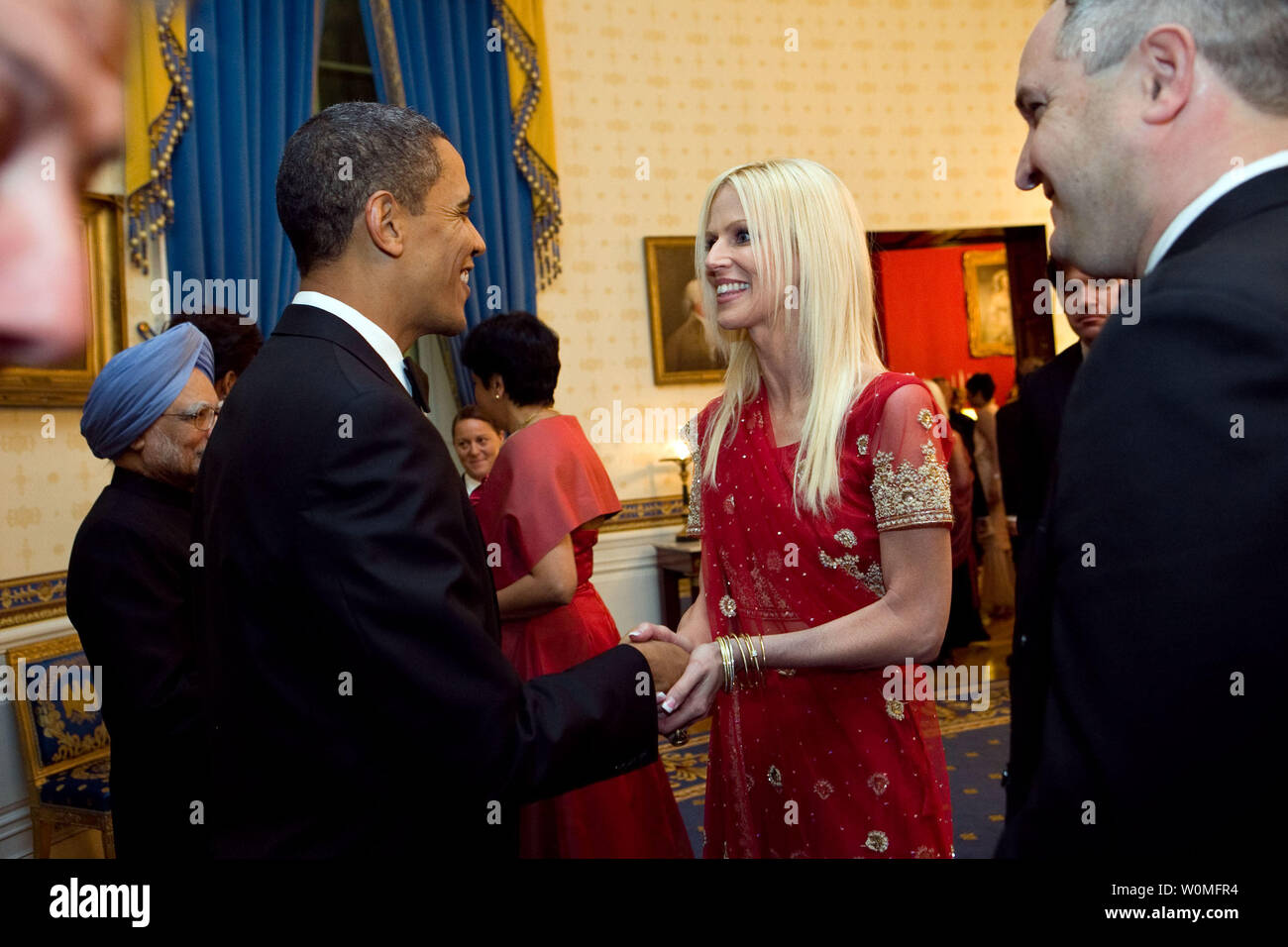 In this photo released by the White House on November 27, 2009, President Barack Obama greets Michaele and Tareq Salahi during a receiving line prior to a State Dinner for Indian Prime Minister Manmohan Singh (back,left) in the Blue Room at the White House in Washington on November 24, 2009. The Secret Service is looking into its own security procedures after the uninvited Virginia couple was able to get into the dinner.   UPI/Samantha Appleton/White House Stock Photo