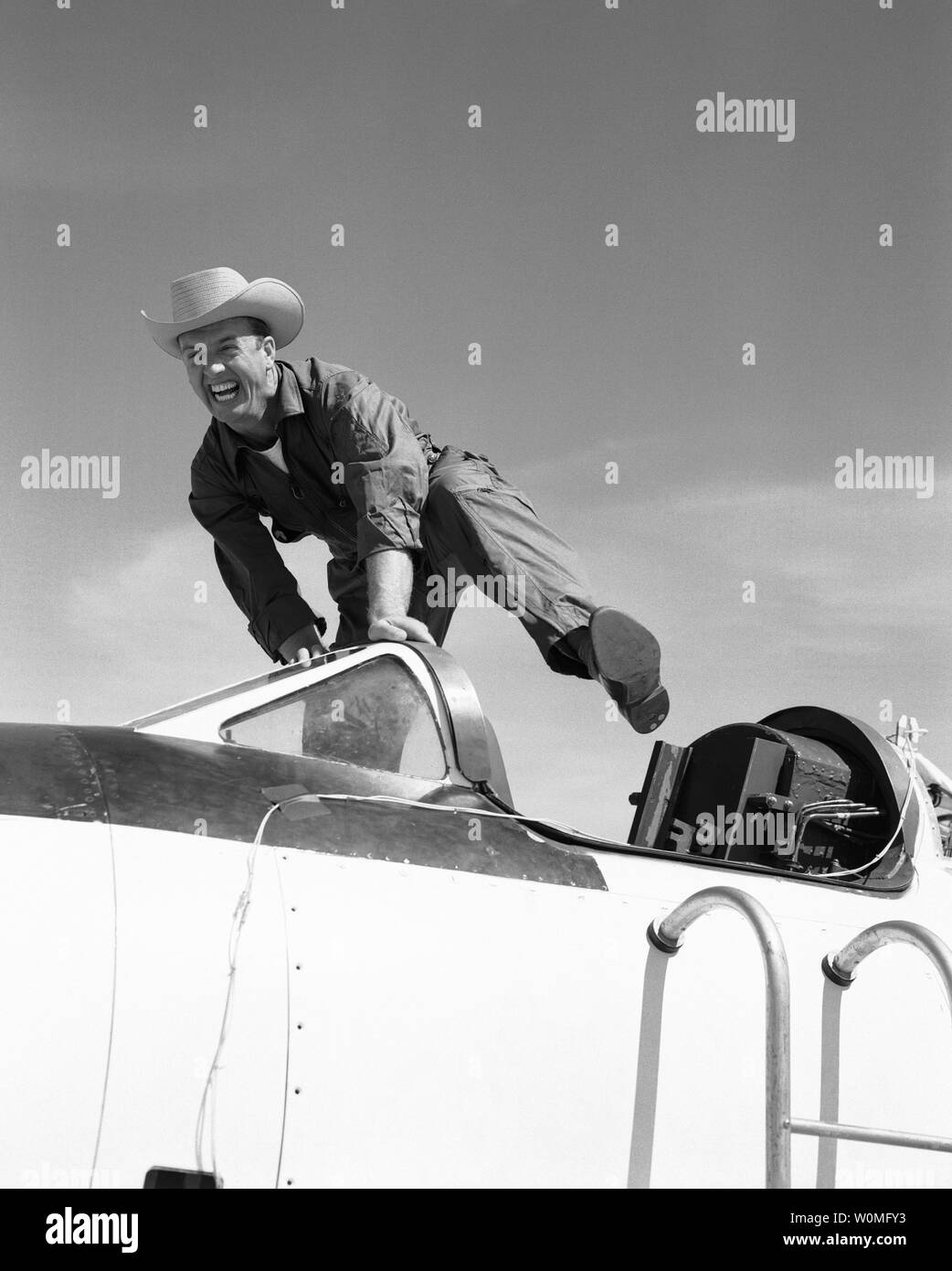 NACA High-Speed Flight Station test pilot Joseph 'Cowboy Joe' Walker leaps on the Bell Aircraft Corporation X-1A in 1955 at Edwards Air Force Base, California. The X-1A was flown six times by Bell Aircraft Company pilot Jean 'Skip' Ziegler in 1953. Air Force test pilots Maj. Charles 'Chuck' Yeager and Maj. Arthur 'Kit' Murray made 18 flights between 21 November 1953 and 26 August 1954. The X-1A was then turned over to the NACA. UPI/NASA Stock Photo