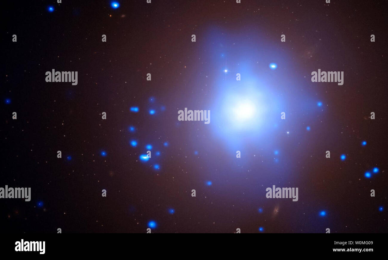 This NASA image released on January 5, 2009, shows Evidence from NASA's Chandra X-ray Observatory and the Magellan telescopes suggest a star was torn apart by an intermediate-mass black hole in a globular cluster. In this image, X-rays from Chandra are shown in blue and are overlaid on an optical image from the Hubble Space Telescope. The Chandra observations show that this object is a so-called ultraluminous X-ray source (ULX). An unusual class of objects, ULXs emit more X-rays than stars, but less than quasars. Their exact nature has remained a mystery, but one suggestion is that some ULXs a Stock Photo