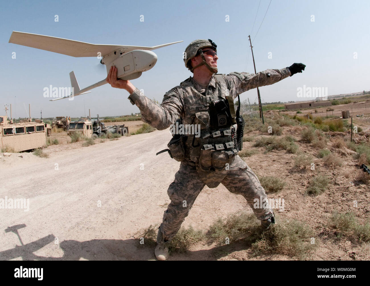Army 1st Lt. Steven Rose launches an RQ-11 Raven unmanned aerial vehicle near a new highway bridge project along the Euphrates River north of Taqqadum, Iraq on October 9, 2009. UPI/Michael J. MacLeod/U.S. Army Stock Photo
