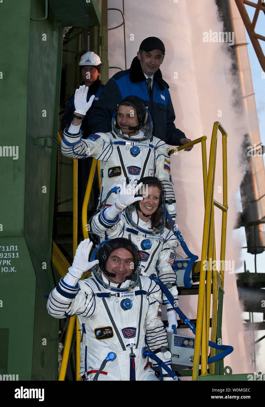 Expedition 23 Flight Engineer Mikhail Kornienko of Russia, top, NASA Flight Engineer Tracy Caldwell Dyson of the U.S. and Soyuz Commander Alexander Skvortsov of Russia, bottom, wave farewell from the bottom of the Soyuz rocket at the Baikonur Cosmodrome in Baikonur, Kazakhstan on April 2, 2010.  Kornienko, Caldwell Dyson and Skvortsov launched in their Soyuz TMA-18 rocket from the Baikonur Cosmodrome in Kazakhstan today at 10:04 a.m.   UPI/Carla Cioffi/NASA Stock Photo