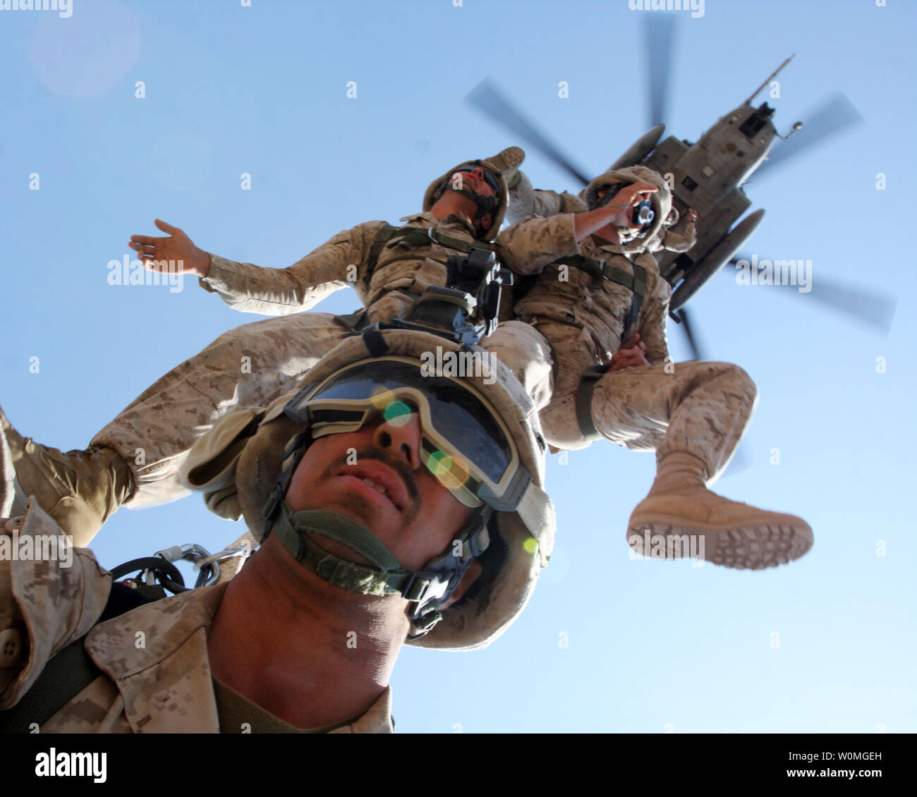 Marines from 24th Marine Expeditionary Unit are suspended from a CH-53 Super Stallion helicopter from Marine Medium Tilt Rotor Squadron 162 during an exercise in Djibouti on March 24, 2010. UPI/Alex C. Sauceda/U.S. Army Stock Photo
