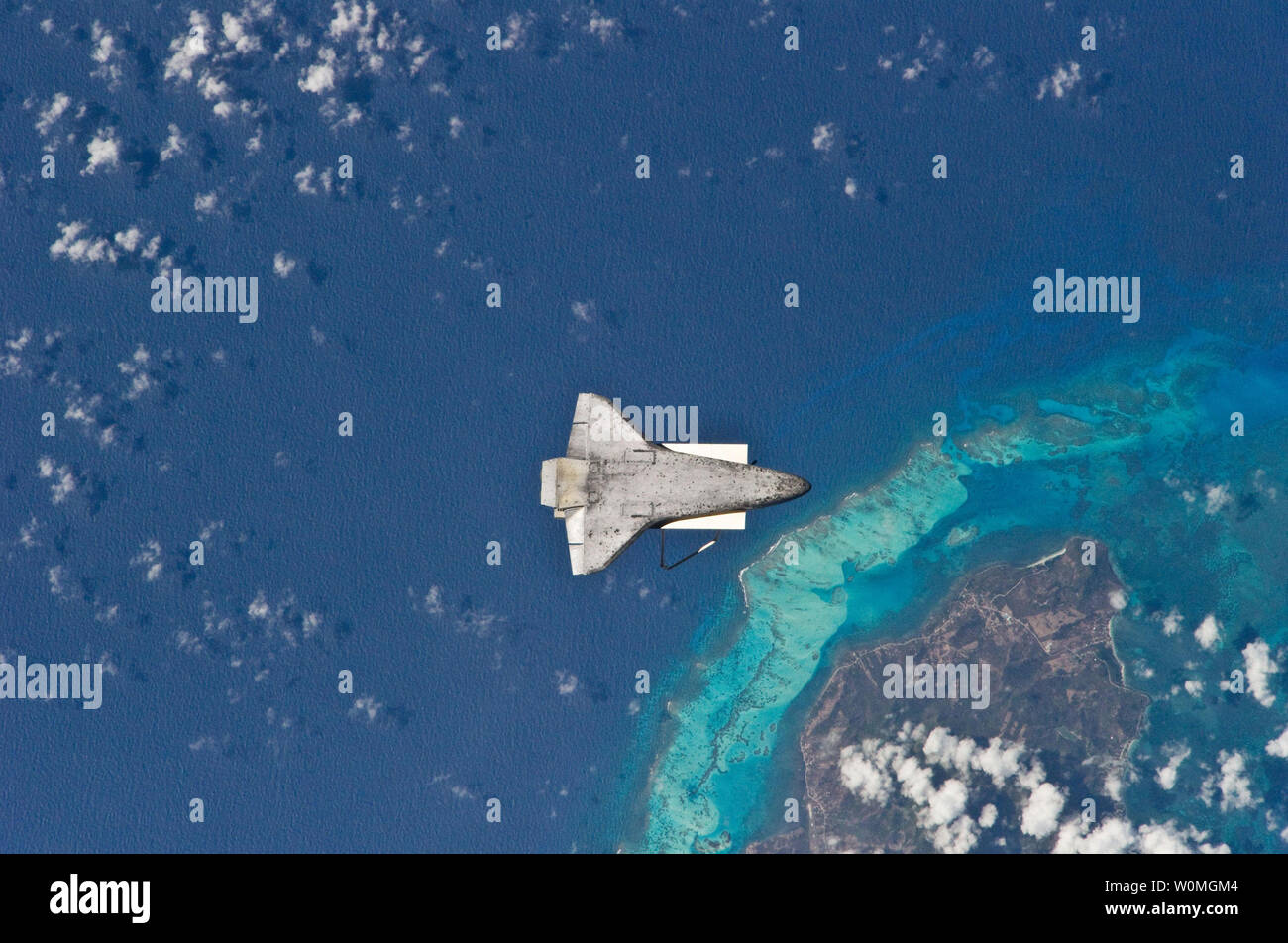 As the Shuttle Discovery and the space station began their post-undocking relative separation, Expedition 23 flight engineer Soichi Noguchi photographed the underside of the shuttle over the south end of Isla de Providencia, about 150 miles off the coast of Nicaragua. Undocking of the two spacecraft occurred on April 17, 2010, ending the shuttle's 10-day stay. The visit included three spacewalks and delivery of more than seven tons of equipment and supplies to the station.   UPI/NASA. Stock Photo