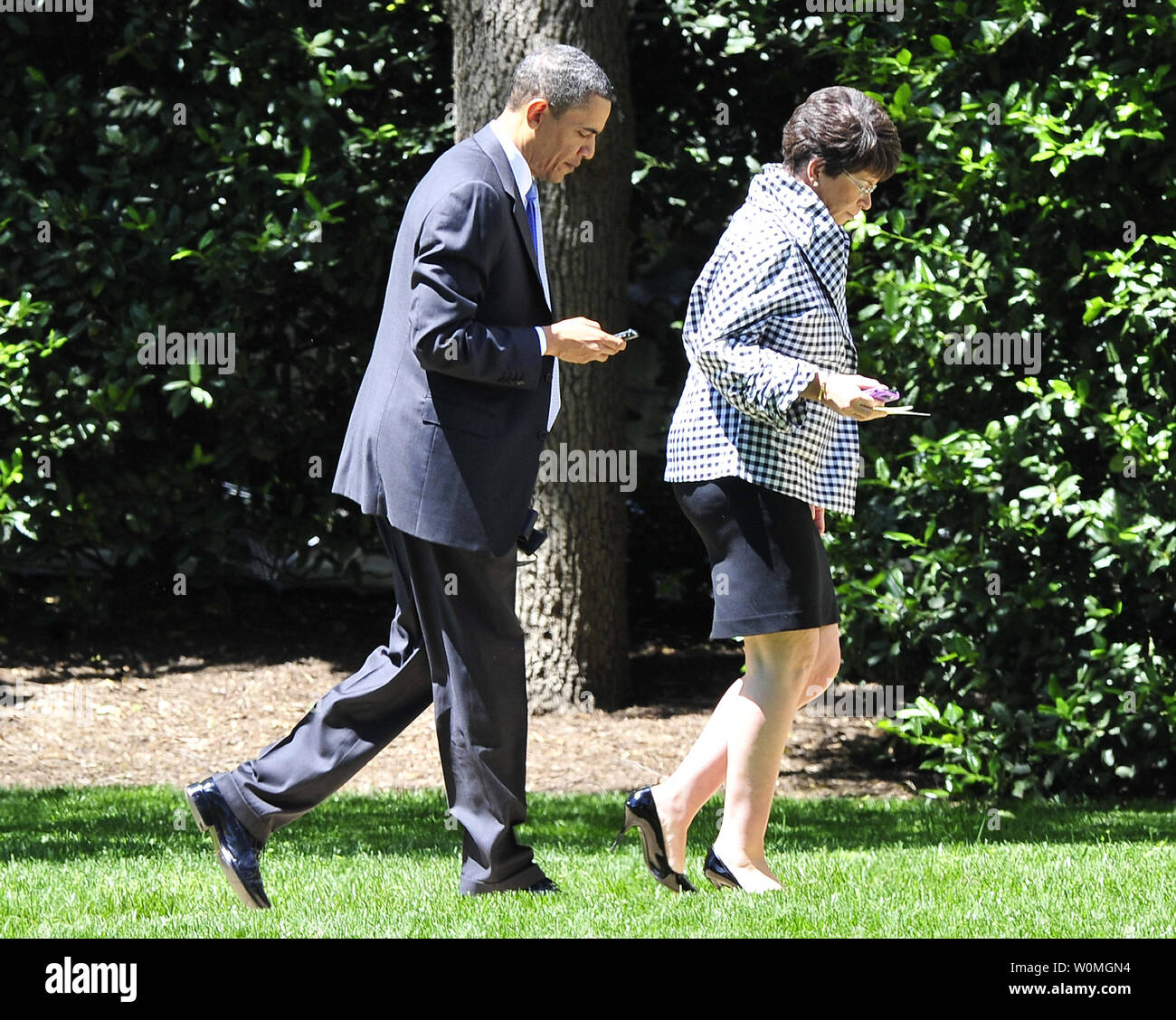 U.S. President Barack Obama looks at his Blackberry as he and Valerie Jarrett walk toward the Oval Office of the White House after Obama spoke to the Business Council at the Park Hyatt Hotel in Washington on May 4, 2010. In his remarks the President also spoke about the attempted bombing in Times Square.  UPI/Ron SachsPool Stock Photo