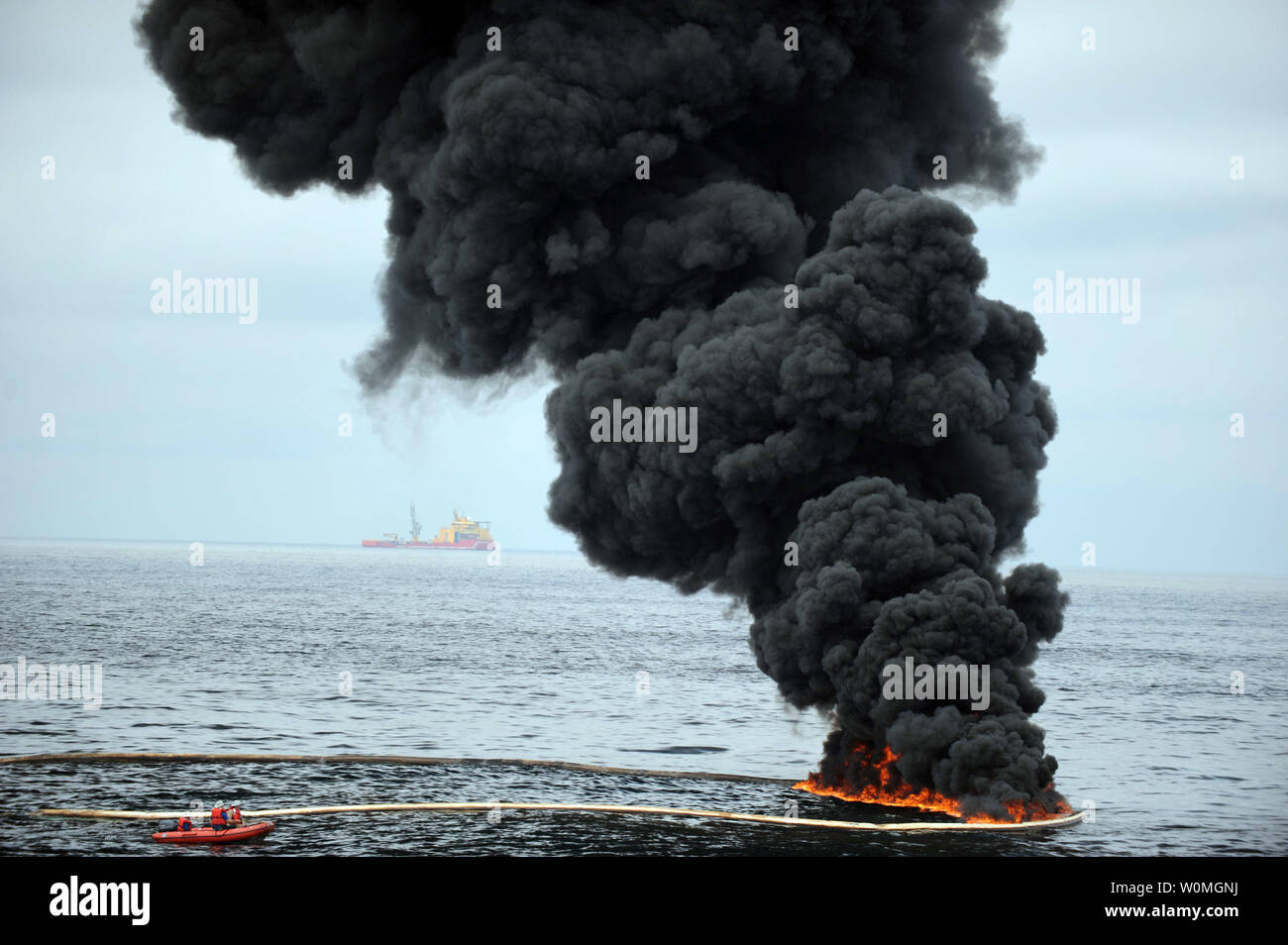 Gathered concentrated oil burns during a controlled oil fire in the Gulf of Mexico on May 5, 2010. The U.S. Coast Guard working in partnership with BP PLC, local residents, and other federal agencies conducted the 'in situ burn' to aid in preventing the spread of oil following the April 20 explosion on Mobile Offshore Drilling Unit Deepwater Horizon.   UPI/Justin E. Stumberg/U.S. Navy Stock Photo