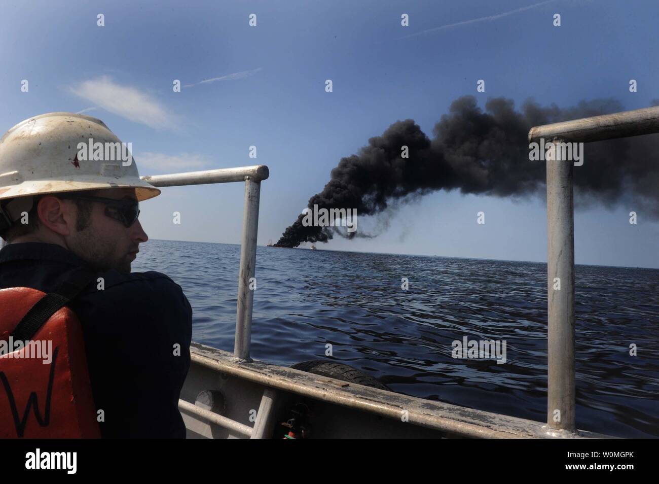 Adam Shaw, a Louisiana oilfield diver assigned to the Premier Explorer, performs a surveillance mission during a controlled fire of the oil-covered waters in the Gulf of Mexico, May 7. The U.S. Coast Guard working in partnership with BP PLC, local residents, and other federal agencies is conducting the Òin situ burnsÓ to aid in preventing the spread of oil following last month's explosion on Mobile Offshore Drilling Unit Deepwater Horizon. UPI/Jeffery Tilghman Williams/DOD Stock Photo