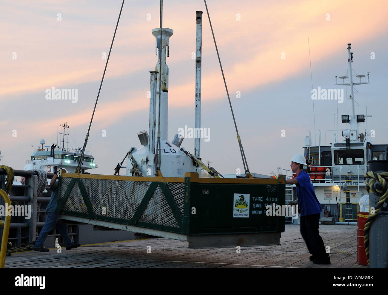 A small pollution containment chamber, known as the top hat, is loaded onto the deck of the motor vessel Gulf Protector at Wild Well Control Inc. in Port Fourchon, Louisiana on May 10, 2010.  The chamber will be used in an attempt to contain an oil leak that was caused by the mobile offshore drilling unit Deepwater Horizon explosion.    UPI/Patrick Kelley/U.S. Coast Guard Stock Photo