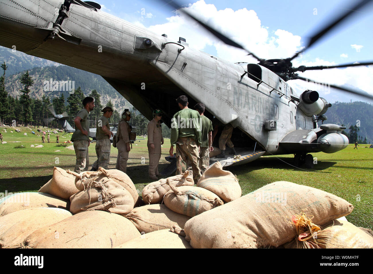 U.S. Navy Crew Members from the 15th Marine Expeditionary Unit and Pakistani soldiers prepare to unload food and supplies for flood relief in Swat Valley, Pakistan, September 5, 2010. UPI/Jason Bushong/US Army Stock Photo