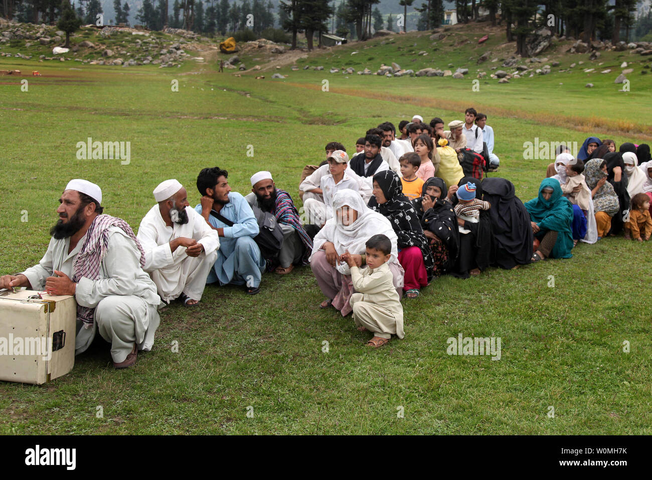 Pakistani flood victims wait to be evacuated by U.S. Navy Pilots from the 15th Marine Expeditionary Unit as part of flood relief relocation process in Swat Valley, Pakistan, September 5, 2010. UPI/Jason Bushong/US Army Stock Photo