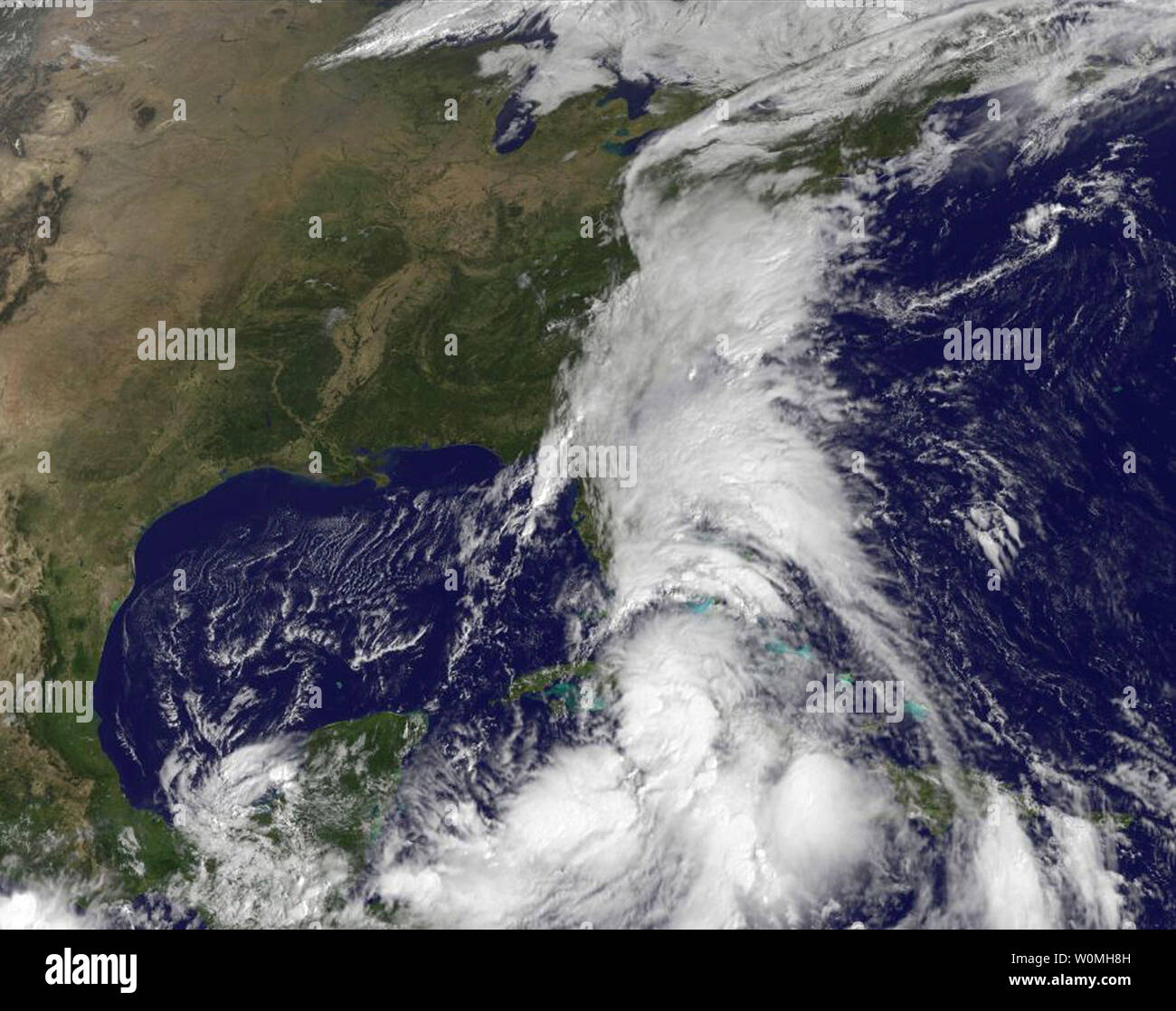 This NASA image taken by the GOES-13 Satellites shows Tropical Storm Nicole (center, bottom) and an extensive of cloud cover extending north into the Mid-Atlantic United States, September 29, 2010.  UPI/NOAA/NASA GOES Stock Photo
