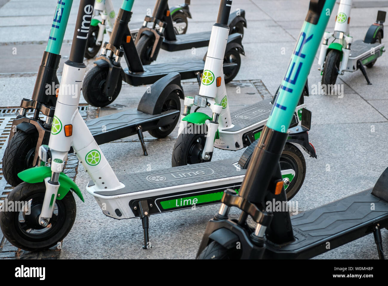 Berlin, Germany - June, 2019: Electric scooter , escooter or e-scooter of  the ride sharing company LIME and TIER on sidewalk in Berlin, Germany Stock  Photo - Alamy