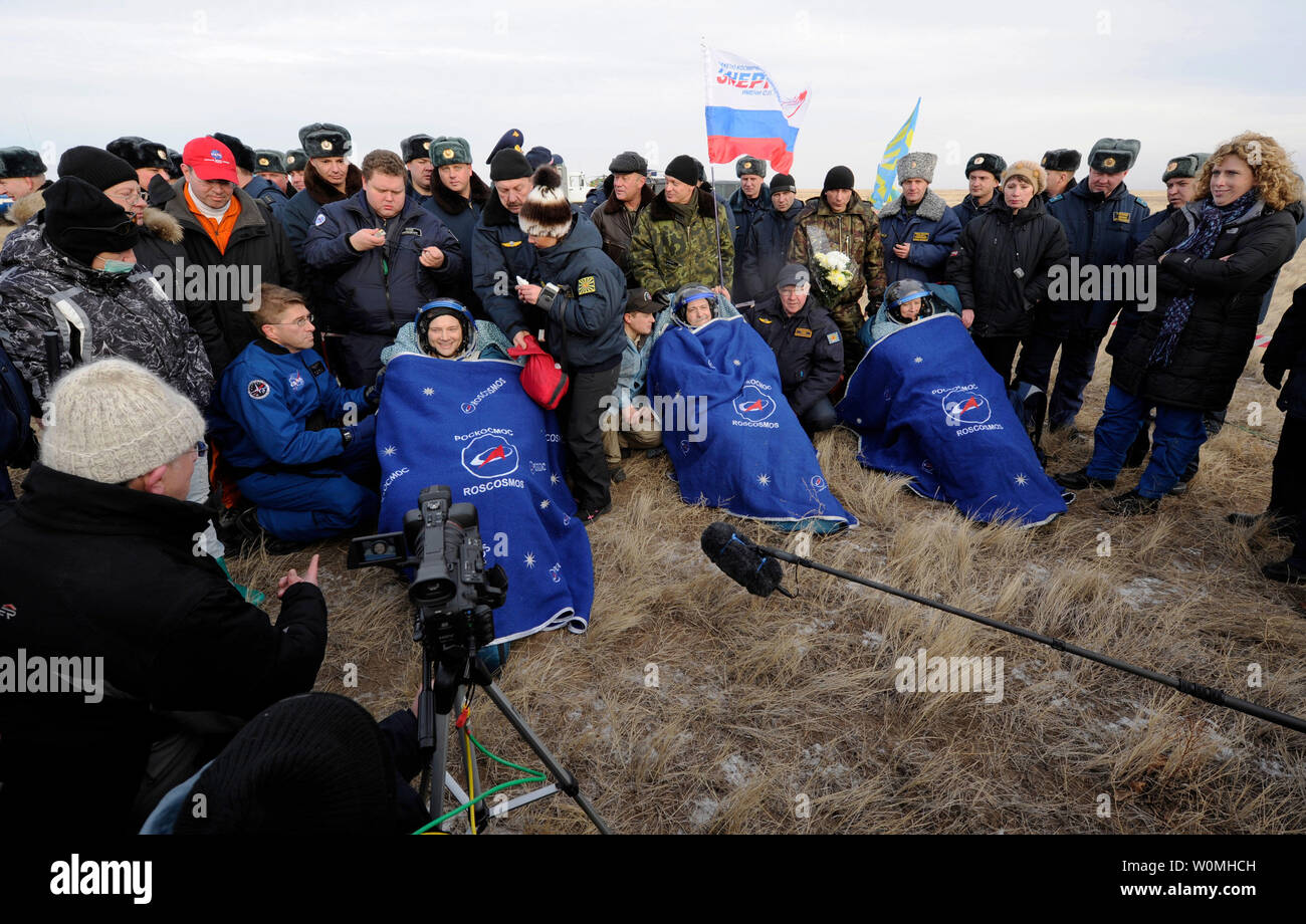 Soyuz TMA-19 crew members including Expedition 25 Commander Doug Wheelock, left, and Flight Engineers Fyodor Yurchikhin and Shannon Walker are seen after being removed from th capsule near the town of Arkalyk, Kazakhstan on Friday, Nov. 26, 2010.  Russian Cosmonaut Yurchikhin and NASA Astronauts Wheelock and Walker, are returning from six months onboard the International Space Station where they served as members of the Expedition 24 and 25 crews.    UPI/Bill Ingalls/NASA Stock Photo