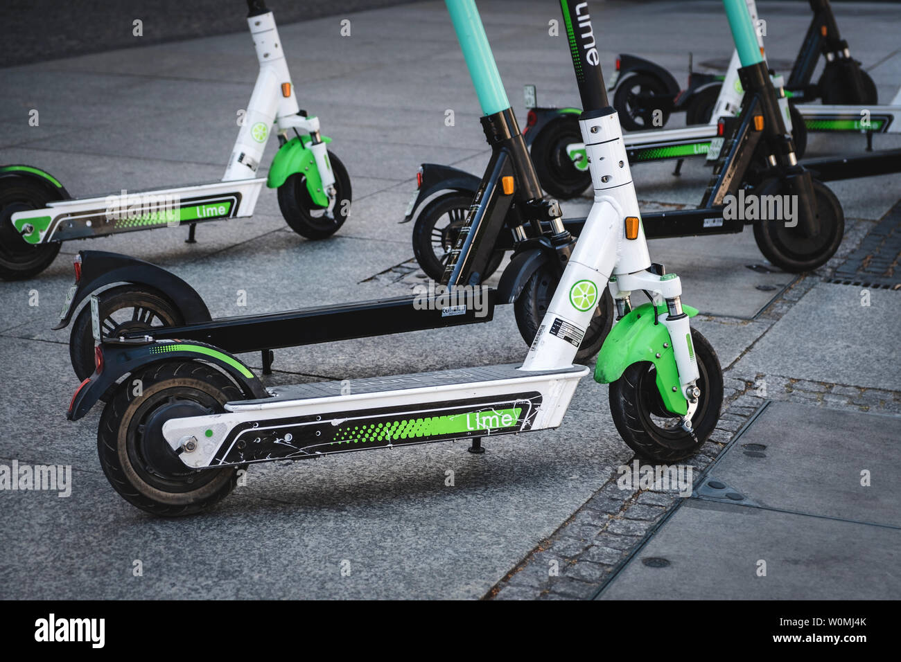 Berlin, Germany - June, 2019: Electric scooter , escooter or e-scooter of  the ride sharing company LIME and TIER on sidewalk in Berlin, Germany Stock  Photo - Alamy