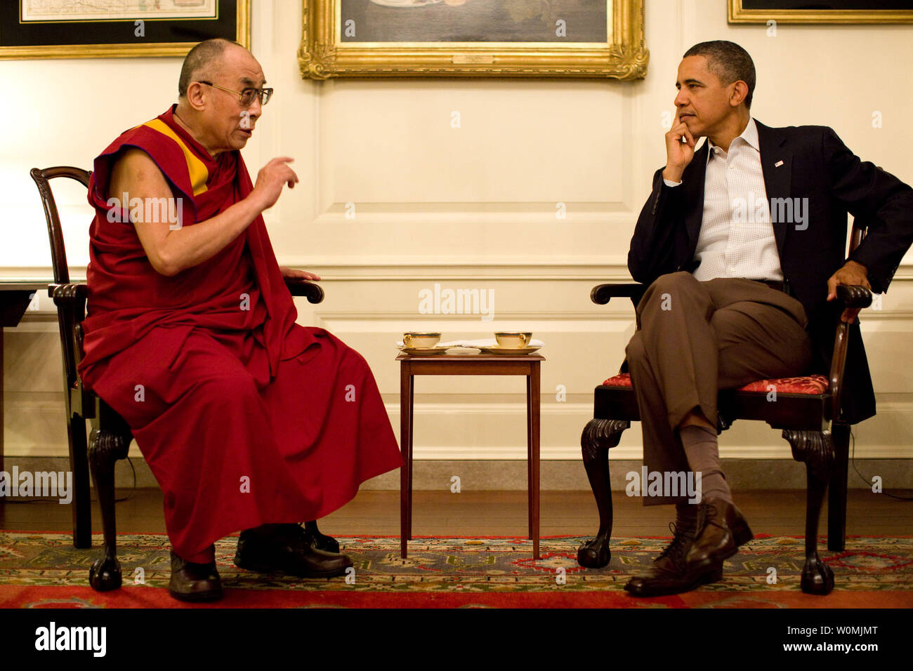 President Barack Obama meets with His Holiness the XIV Dalai Lama in the Map Room of the White House in Washington, D.C. on July 16, 2011. UPI/Pete Souza/White House. Stock Photo