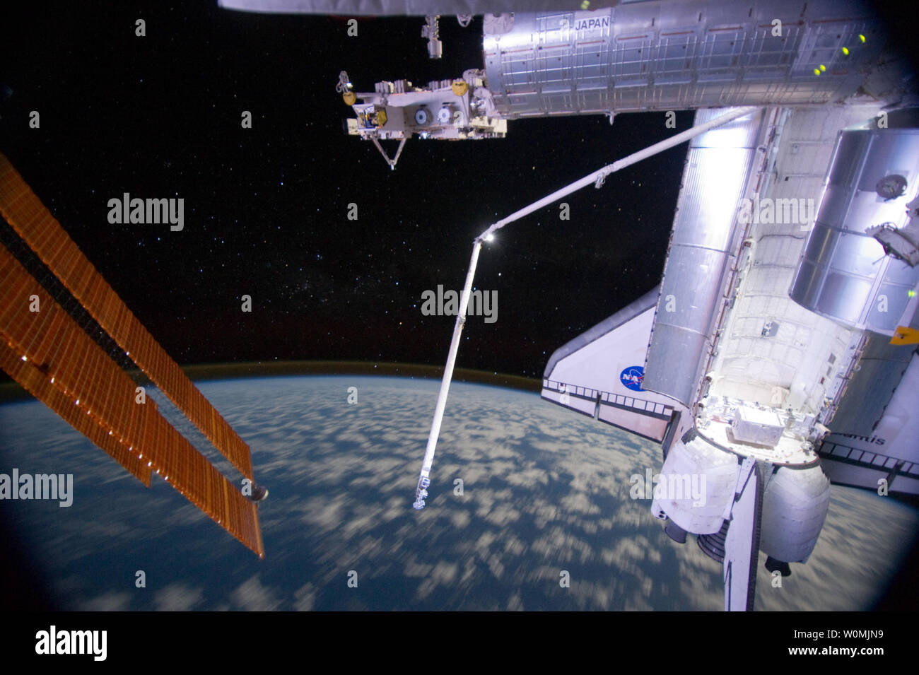 This NASA image taken on July 14, 2011 from the International Space Station, shows part of the docked space shuttle Atlantis' cargo bay and part of the station including a solar array panel as the joint complex passes over the southern hemisphere of Earth. Aurora Australis or the Soutern Lights can be seen on Earth's horizon. Space Shuttle Atlantis is at the International Space Station on mission STS-135, the final shuttle mission. UPI/NASA Stock Photo