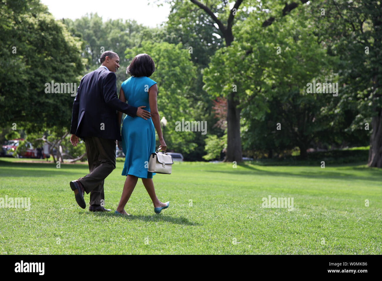 President Barack Obama and First Lady Michelle Obama depart the South Lawn of the White House for a day trip to Ohio and Virginia for the first official campaign rallies of the 2012 election season, in Washington, D.C. on May 5, 2012.  UPI/Kevin Dietsch Stock Photo