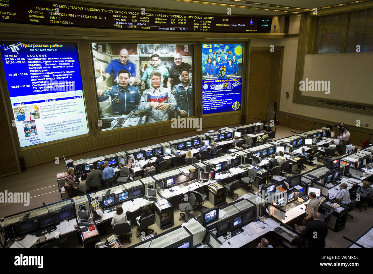 View from the balcony of the Russian Mission Control Center shows live television of the Expedition 31 crew members gathered together on the International Space Station a few hours after the Soyuz TMA-04M spacecraft docked on Thursday, May 17, 2012, in Korolev, Russia. Pictured are Expedition crew members NASA Flight Engineer Don Pettit, back left, Oleg Kononenko of Russia, ESA (European Space Agency) astronaut and Flight Engineer Andre Kuipers, back right, Flight Engineer Sergei Revin, front left, Soyuz Commander Gennady Padalka, and Flight Engineer Joe Acaba, bottom right. Padalka, Revin and Stock Photo