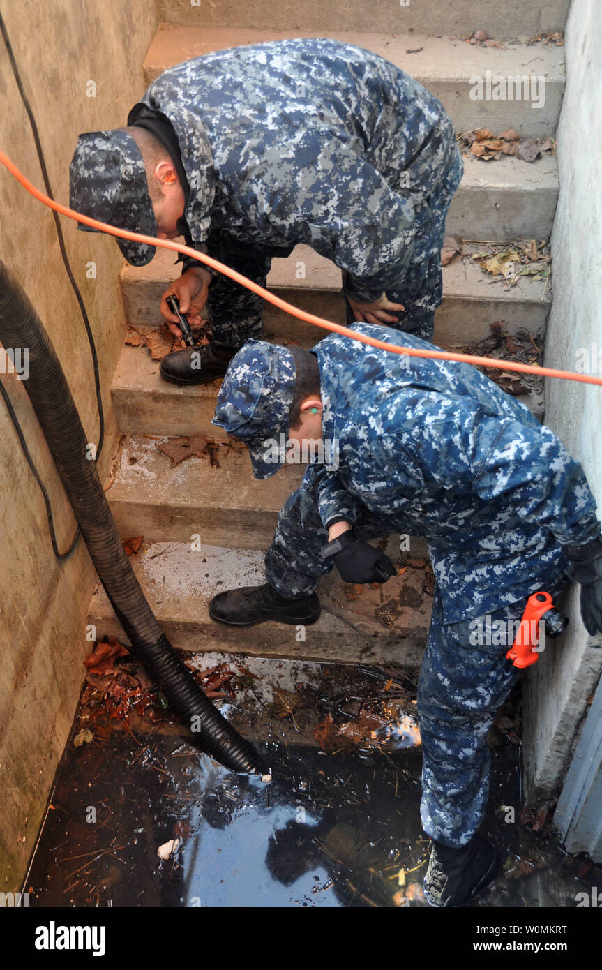 Sailors Phillip Smith and Logan Sellers, both assigned to the amphibious transport dock ship USS San Antonio, monitor a suction hose of a P-100 dewatering pump of the Statue of Liberty on Freedom Island supporting Hurricane Sandy relief efforts on on November 6, 2012 in New York. The U.S. Navy has positioned forces  in support of FEMA and local civil authorities following the destruction caused by Hurricane Sandy.  UPI/Terah L. Mollise/Navy Stock Photo