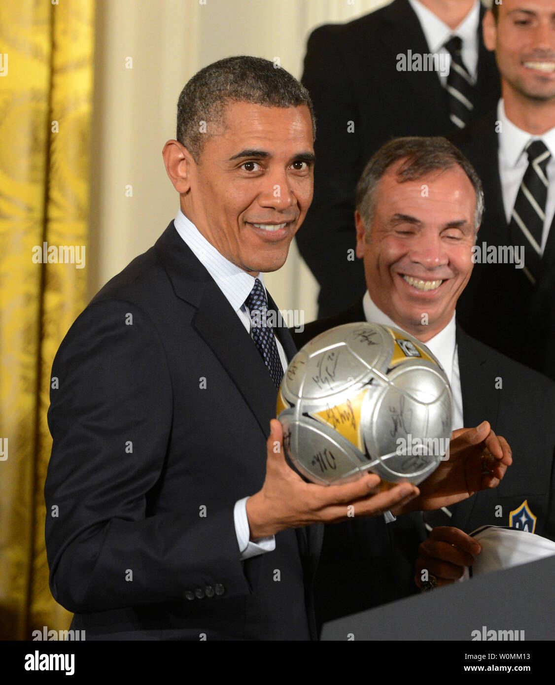 https://c8.alamy.com/comp/W0MM13/us-president-barack-obama-holds-a-soccer-ball-with-la-galaxy-head-coach-bruce-arena-during-an-east-room-ceremony-honoring-players-and-coaches-from-the-major-league-soccer-mls-champions-la-galaxy-and-the-los-angeles-national-hockey-league-nhl-champions-los-angeles-kings-at-the-white-house-in-washington-dc-on-march-26-2013-upipat-benic-W0MM13.jpg