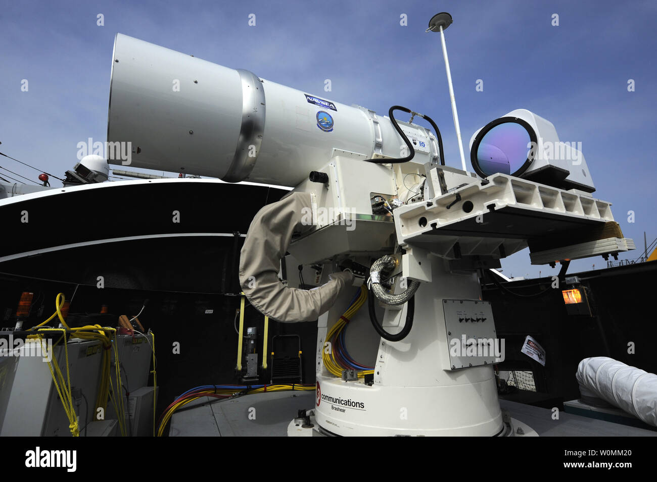 The Laser Weapon System (LaWS) is temporarily installed aboard the guided-missile destroyer USS Dewey (DDG 105) in San Diego, California, July 2012. The U.S. Navy announced on April 8, 2013 that it will deploy for the first time one of its ships that could be used for shooting down drones and disabling vessels.  The prototype will be installed aboard the USS Ponce within the next year. The weapon runs on electricity so the cost is less than $1 per shot. UPI/John Williams/U.S.NAVY Stock Photo