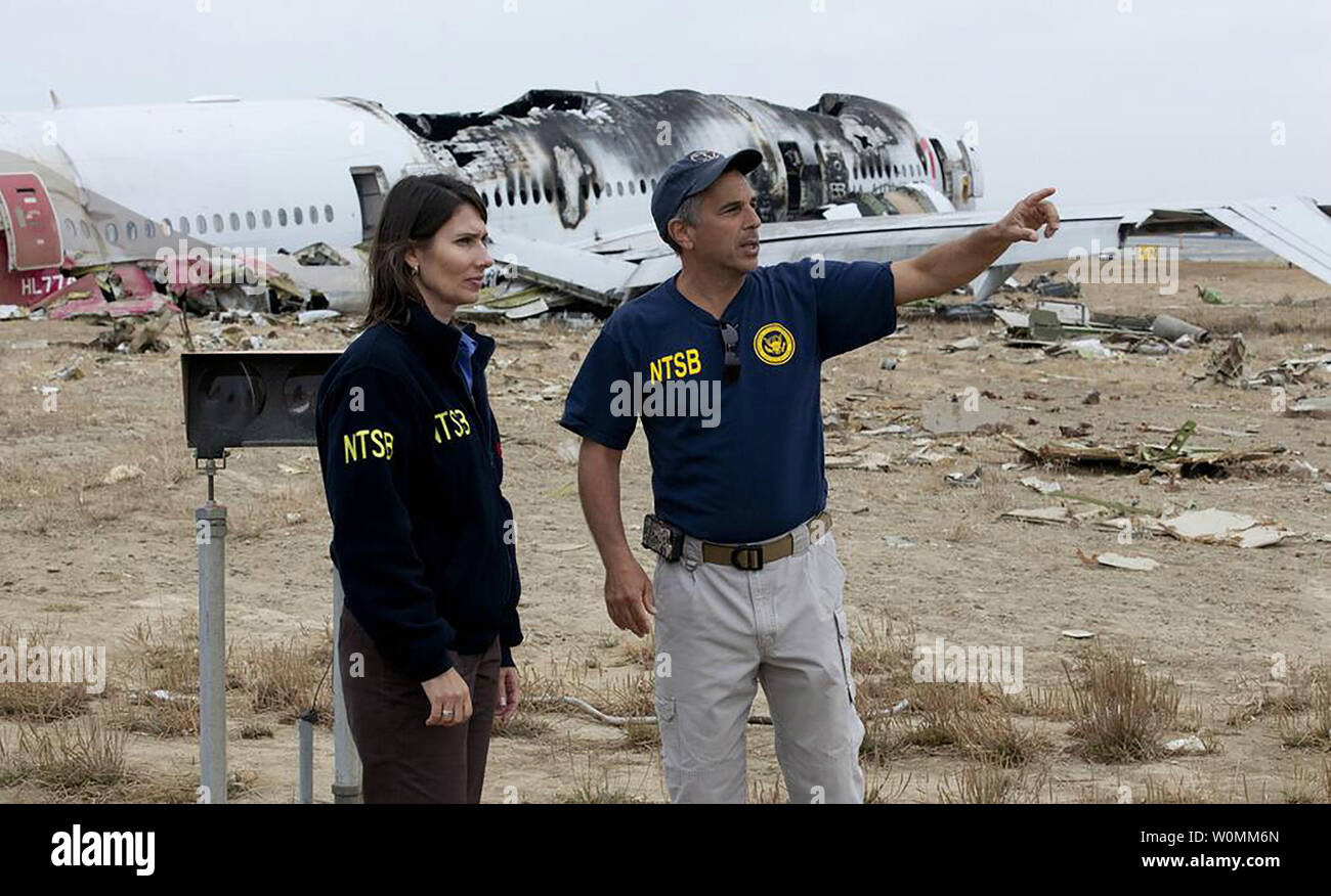 in-this-photo-provided-by-the-national-transportation-safety-board-ntsb-ntsb-deborah-chairman-hersman-and-lead-investigator-bill-english-survey-the-accident-scene-of-asiana-flight-214-in-san-francisco-california