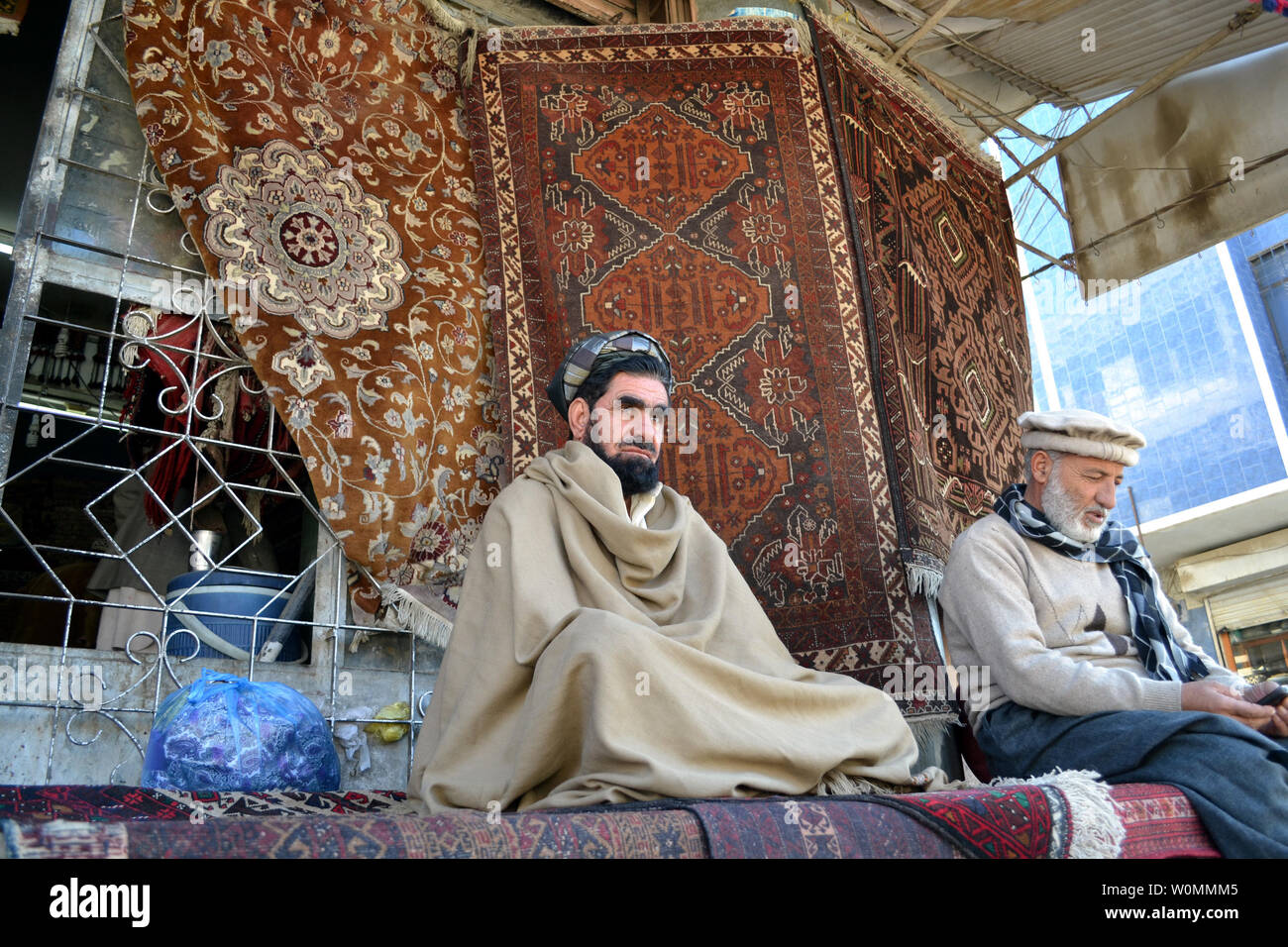 Men sit on carpets in the border town of Quetta, Pakistan, in the Baluchistan province, January 18, 2014. Balochistan, due to its tribal culture that prefers carpets over chairs and sofas, has always been partial to rugs and is a huge buyer of carpets from both Afghanistan and Iran, which share its borders. UPI/Matiullah Stock Photo