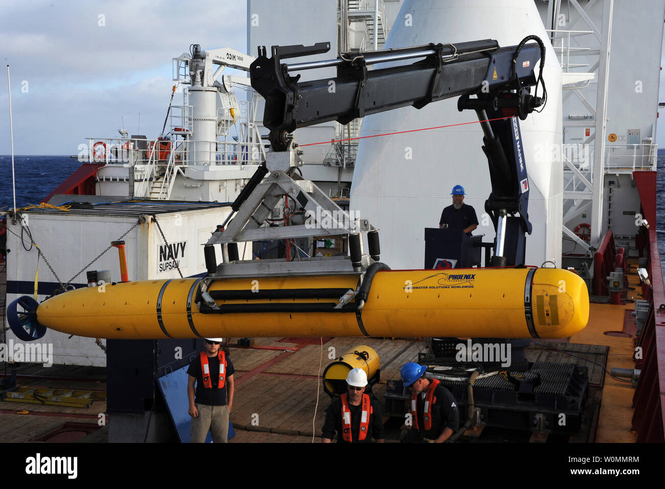 Operators Aboard The Australian Defense Vessel Ocean Shield Move