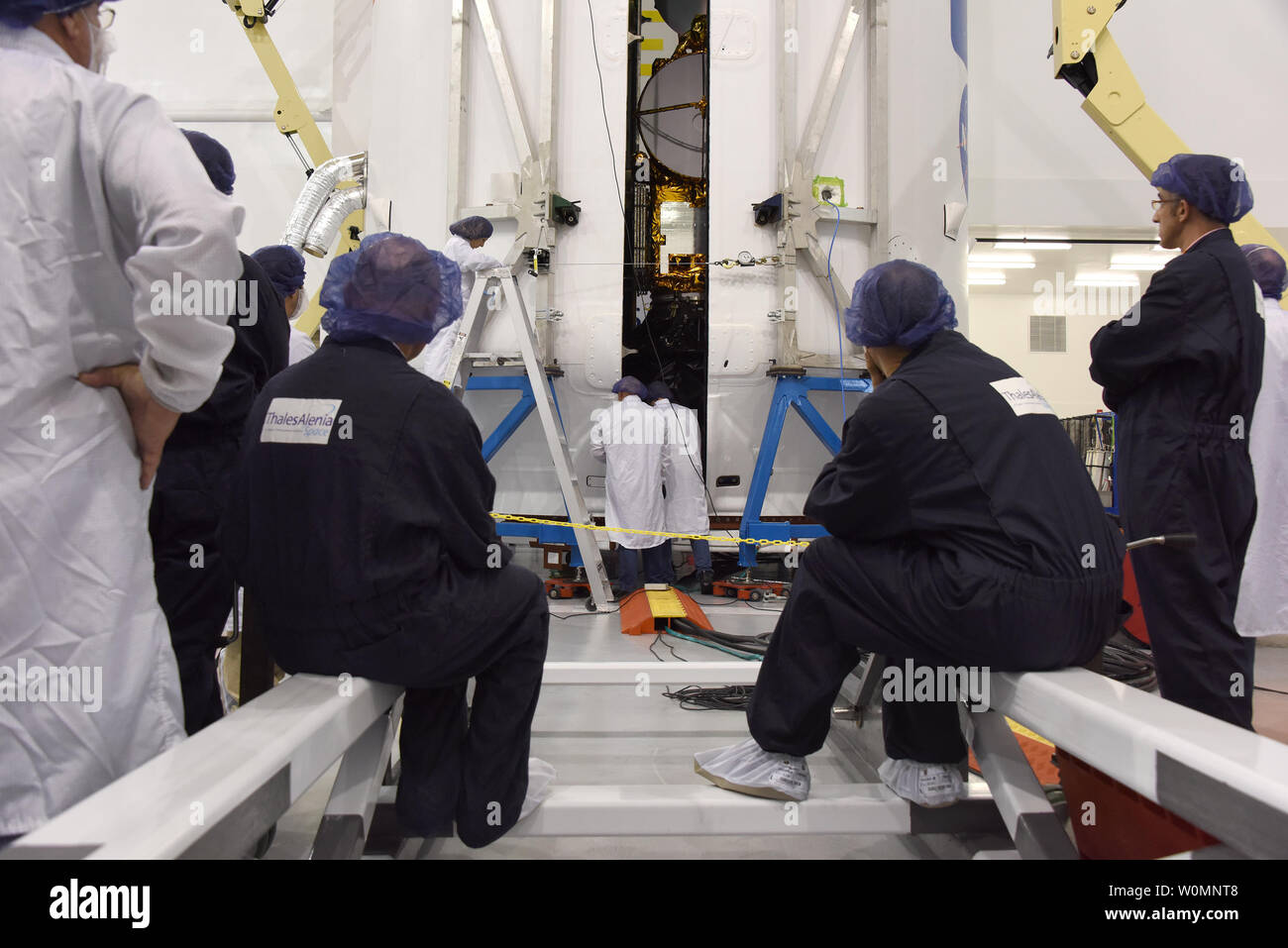 In the SpaceX Payload Processing Facility at Vandenberg Air Force Base on January 11, 2016, the Jason-3 satellite is prepared for encapsulation in its payload faring. Once the encapsulating is complete, it will be mated to a SpaceX Falcon 9 rocket at Vandenberg's Space Launch Complex 4. Jason-3, an international mission led by the National Oceanic and Atmospheric Administration (NOAA), will help continue U.S.-European satellite measurements of global ocean height changes.    NASA/UPI Stock Photo