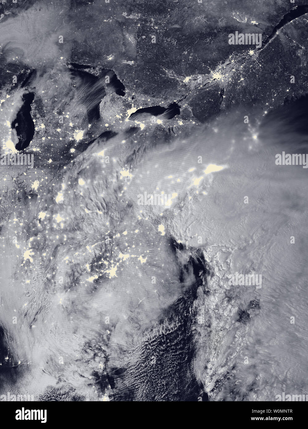 NASA and NOAA satellites are tracking the large winter storm that is expected to bring heavy snowfall to the U.S. mid-Atlantic region on January 22 and 23. NASA-NOAA's Suomi NPP satellite snapped this image of the approaching blizzard around 2:15 a.m. EST on January 23, 2016 using the Visible Infrared Imaging Radiometer Suite (VIIRS) instrument's Day-Night band. In the image, the clouds are lit from above by the nearly full Moon and from below by the lights of the heavily populated East Coast. The city lights are blurred in places by cloud cover. UPI Stock Photo