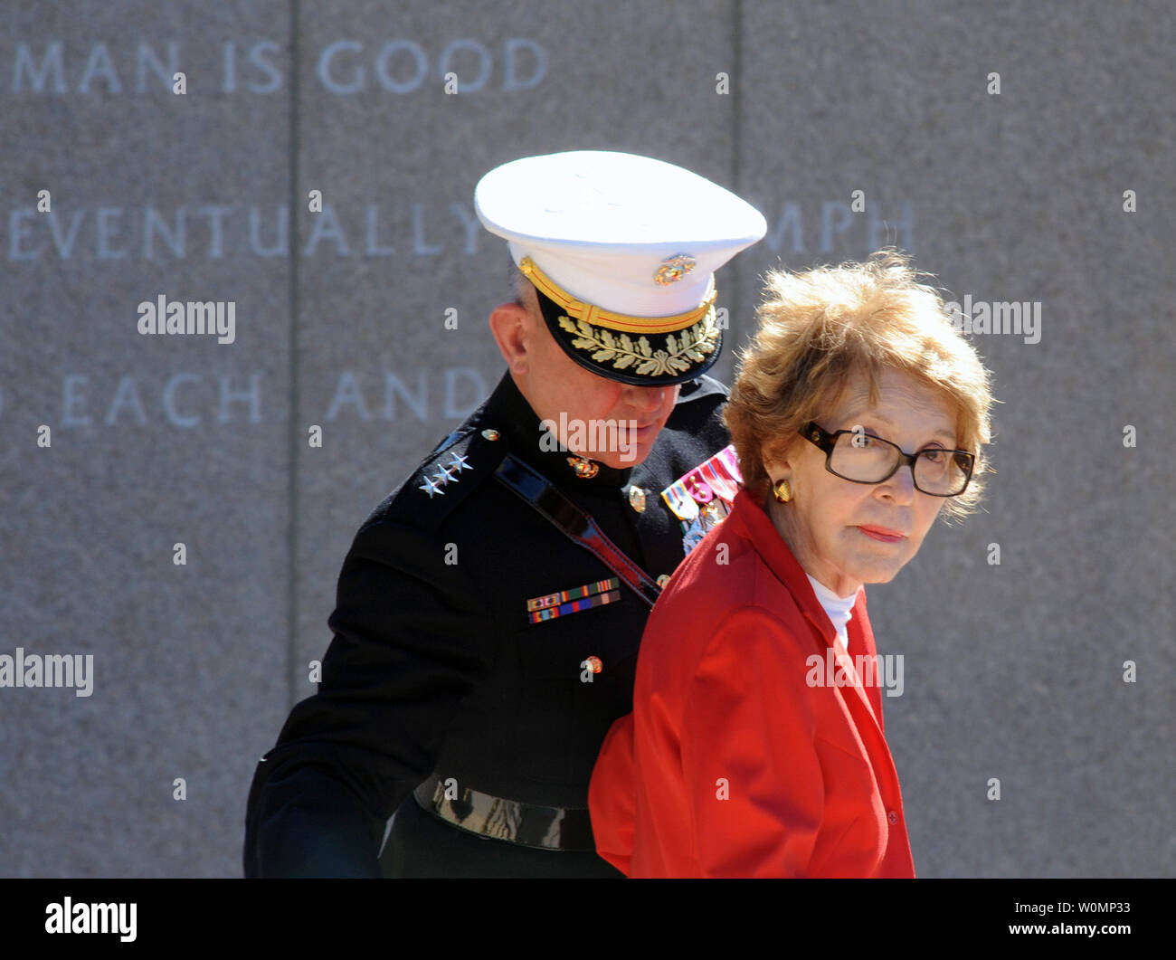 In this file photo, former first lady Nancy Reagan is helped by Marine ...