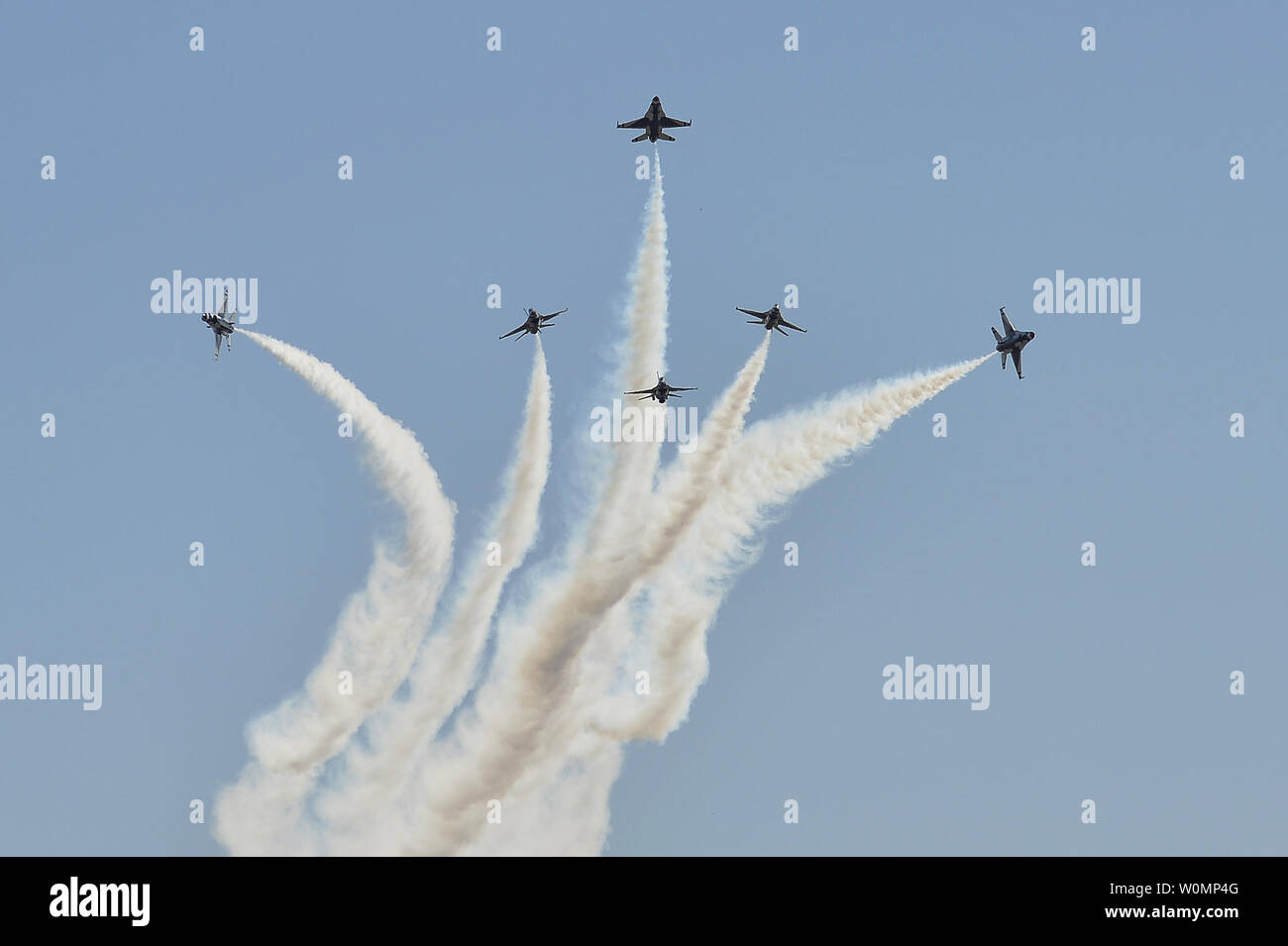 The Thunderbirds pilots perform the Delta Burst maneuver during the