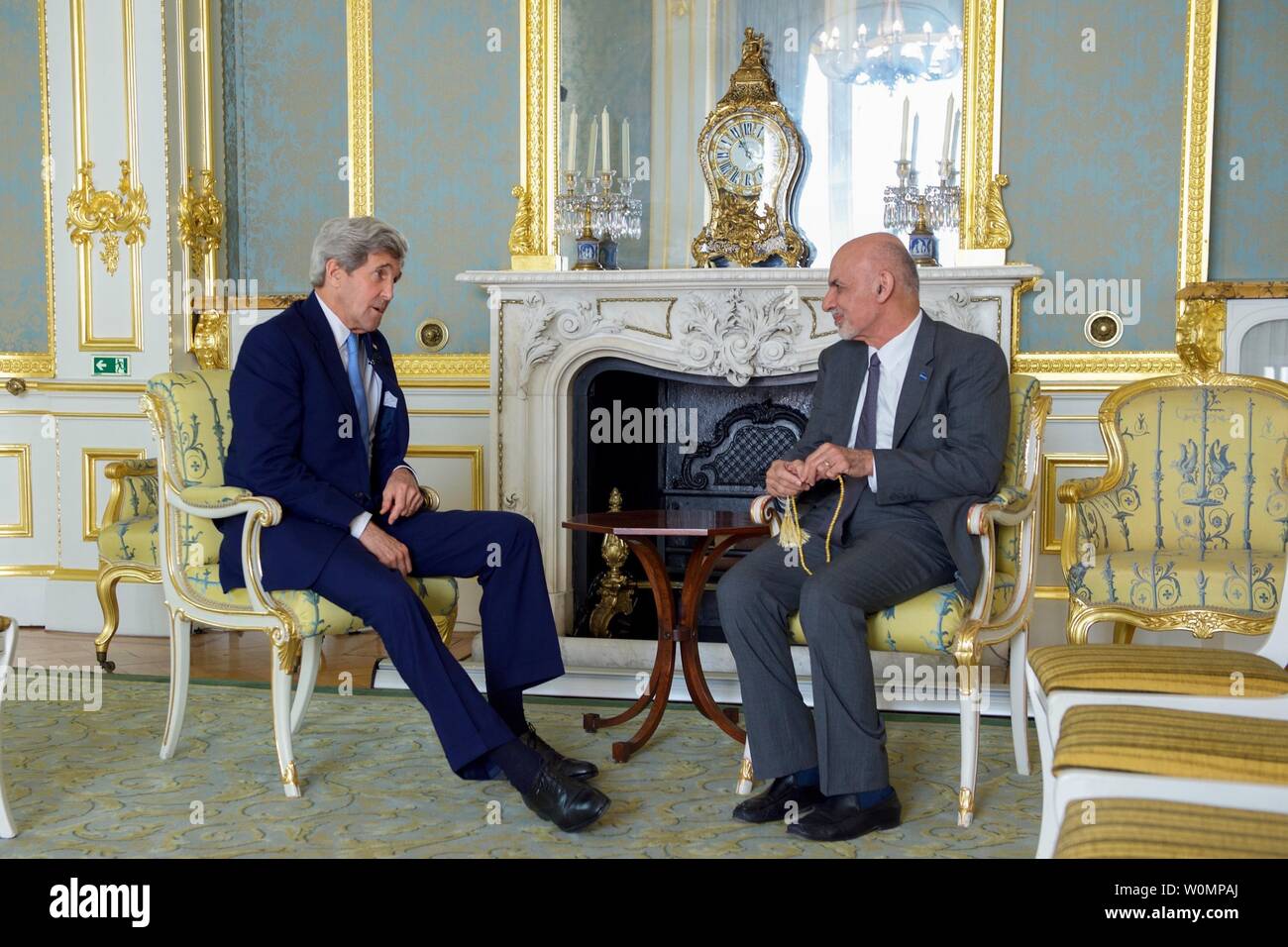 U.S. Secretary of State John Kerry has a pull-aside discussion with Afghanistan President Ashraf Ghani on May 12, 2016, at Lancaster House in London, amid their joint attendance at an anti-corruption summit meeting hosted by the British leader. Photo by U.S. Department of State/UPI Stock Photo
