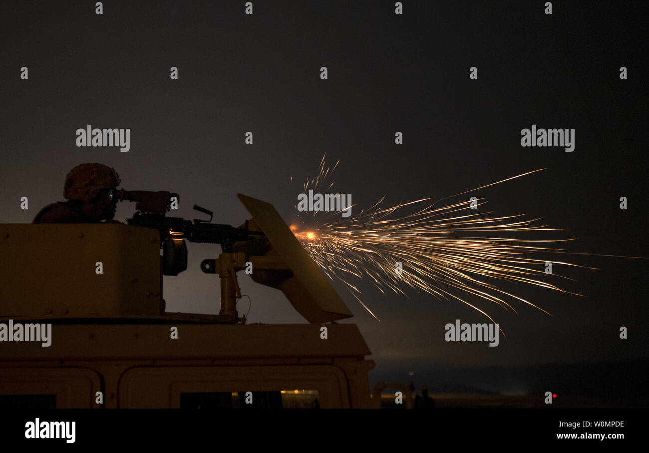 A U.S. Army Reserve military police Soldier from the 341st MP Company, of Mountain View, Calif., fires an M249 Squad Automatic Weapon mounted on a High Mobility Multi-Purpose Wheeled Vehicle turret during a night fire qualification table at Fort Hunter-Liggett, Calif., on May 4, 2016. The 341st MP Co. is one of the first units in the Army Reserve conducting a complete 6-table crew-serve weapon qualification, which includes firing the M2, M249 and M240B machine guns both during the day and night. Photo by Master Sgt. Michel Sauret/U.S. Army/UPI Stock Photo