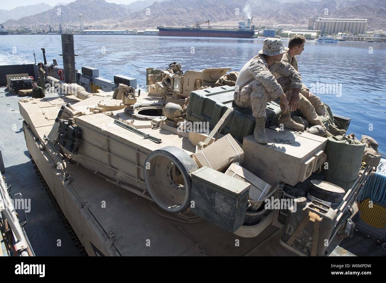 An M1A1 Abrams tank is transported by the Landing Craft, Utility 1635 to the dock landing ship USS Harpers Ferry (LSD 49) on May 28, 2016, while stationed in the Gulf of Aqaba. The crew of Harpers Ferry is part of about 3,000 U.S. military personnel C representing USCENTCOM headquarters and its components C who will participate in this yearÕs bilateral exercise, exercise Eager Lion 16, with the Jordan Armed Forces. Photo by Mass Communication Specialist 3rd Class Zachary Eshleman/U.S. Navy/UPI Stock Photo