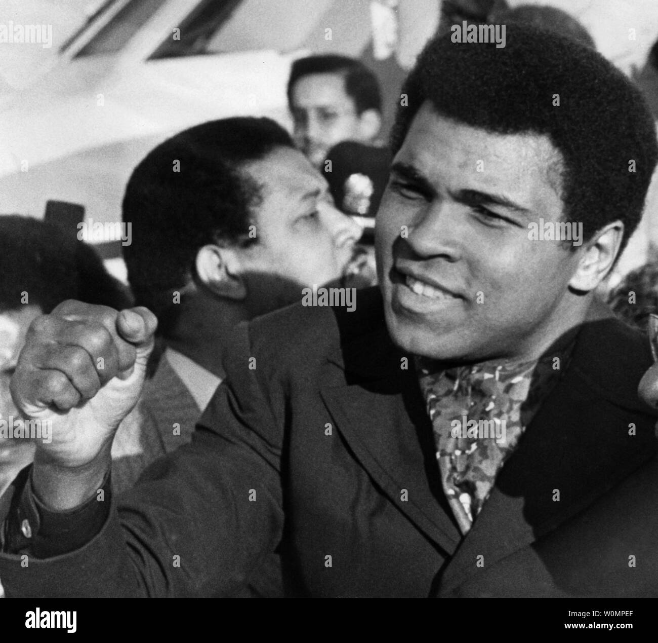 Boxing great Muhammad Ali died at the age of 74 in Phoenix, Arizona on Saturday, June 4, 2016.  He is shown  acknowledging cheers of the crowd at Chicago's Midway Airport on November 1, 1974, after his arrival from Zaire, Africa, where he beat George Foreman to regain his world heavyweight boxing title.   File Photo by Ray Foli/UPI Stock Photo