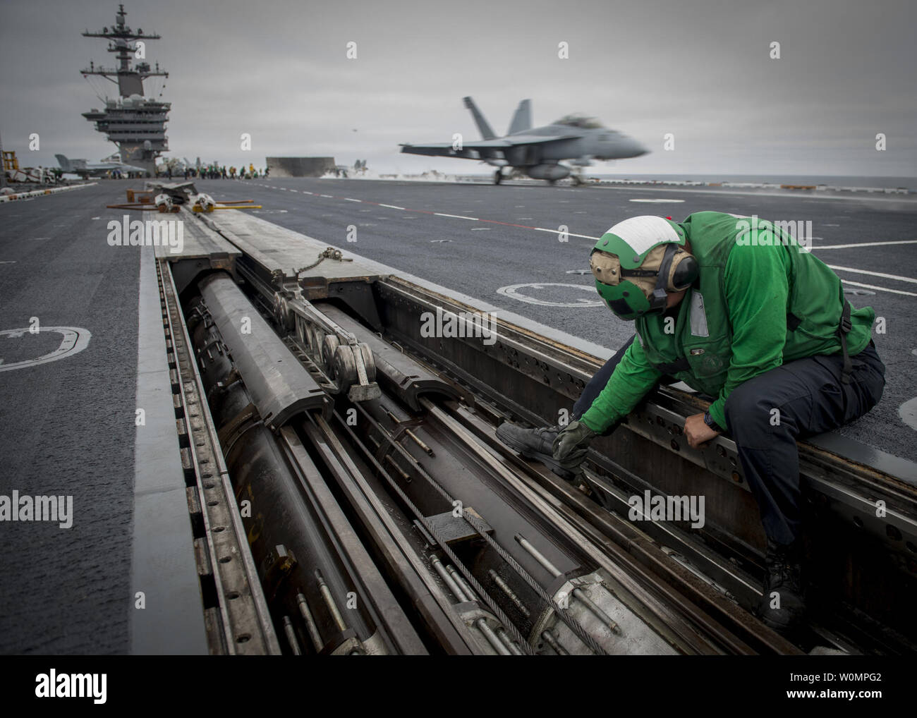 Aviation BoatswainÕs Mate (Equipment) Airman Zach Walker performs maintenance on a catapult on the flight deck of the aircraft carrier USS Carl Vinson (CVN 70) on June 7, 2016. The ship is underway conducting command assessment of readiness and training (CART) II off the coast of Southern California. Photo by Specialist 3rd Class Sean Castellano/U.S. Navy/UPI Stock Photo