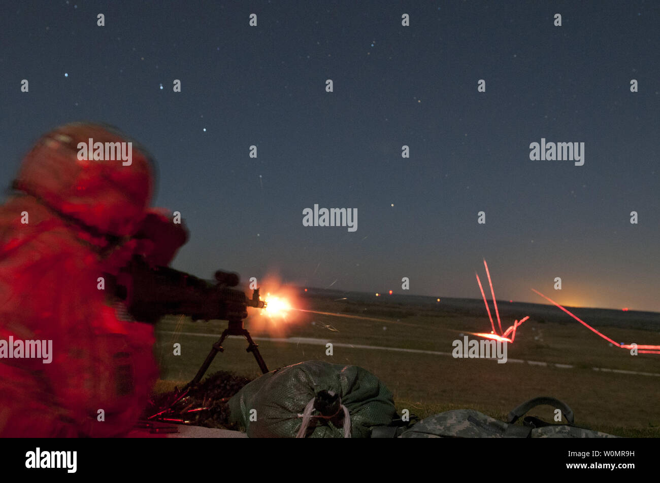 Cpt. Michael Webb, an Army Reserve Soldier with the 316th Sustainment Command (Expeditionary), based out of Coraopolis, Pa., fires a M240B machine gun during night qualification at Fort Hood, Tx., on October 10, 2016. This is to prepare the Soldiers of the 316th during their pre-deployment training. Photo by Dalton Smith/U.S. Army/UPI Stock Photo