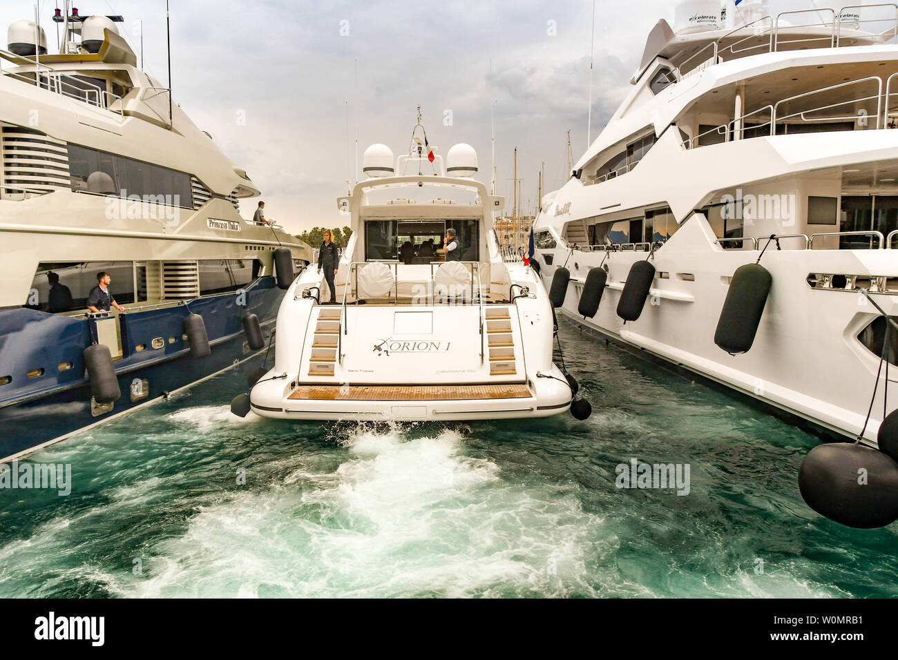 CANNES, FRANCE - APRIL 2019: Luxury motor yacht Orion I reversing into its harbour berth in Cannes. Stock Photo