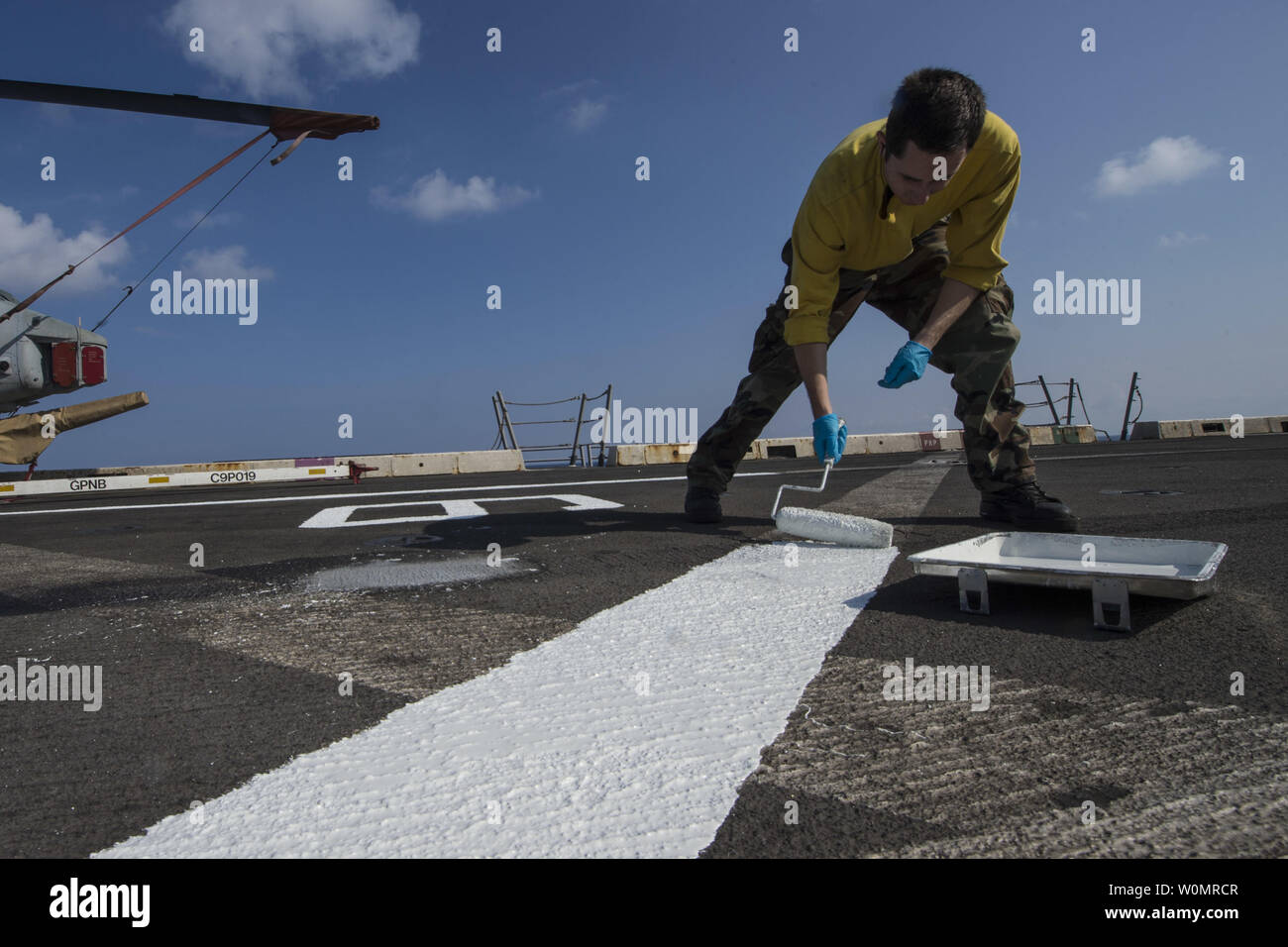 Seaman Brad McNamee paints the flight deck aboard the amphibious transport dock ship USS San Antonio (LPD 17) on November 23, 2016. San Antonio is deployed with the Wasp Amphibious Ready Group to support maritime security operations and theater security cooperation efforts in the U.S. 6th Fleet area of operation. Photo by Petty Officer 2nd Class Adam Austin/U.S. Navy/UPI Stock Photo