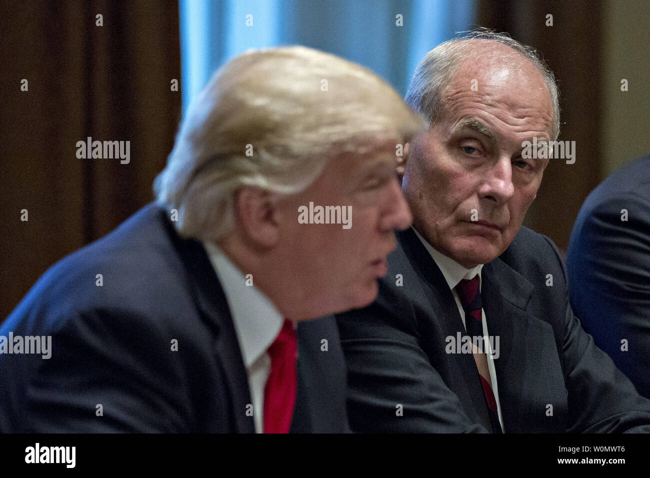 John Kelly, White House chief of staff, listens as U.S. President Donald Trump, left, speaks during a briefing with senior military leaders in the Cabinet Room of the White House in Washington, D.C. on October 5, 2017. Defense Secretary Jim Mattis said this week the U.S. and allies are 'holding the line' against the Taliban in Afghanistan as forecasts of a significant offensive by the militants 'remain unfulfilled'.     Photo by Andrew Harrer/UPI Stock Photo