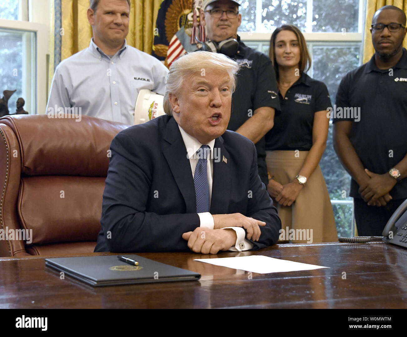 United States President Donald J. Trump makes remarks prior to signing the National Manufacturing Day Proclamation in the Oval Office of the White House in Washington, DC on October 6, 2017.           Photo by Ron Sachs/UPI Stock Photo