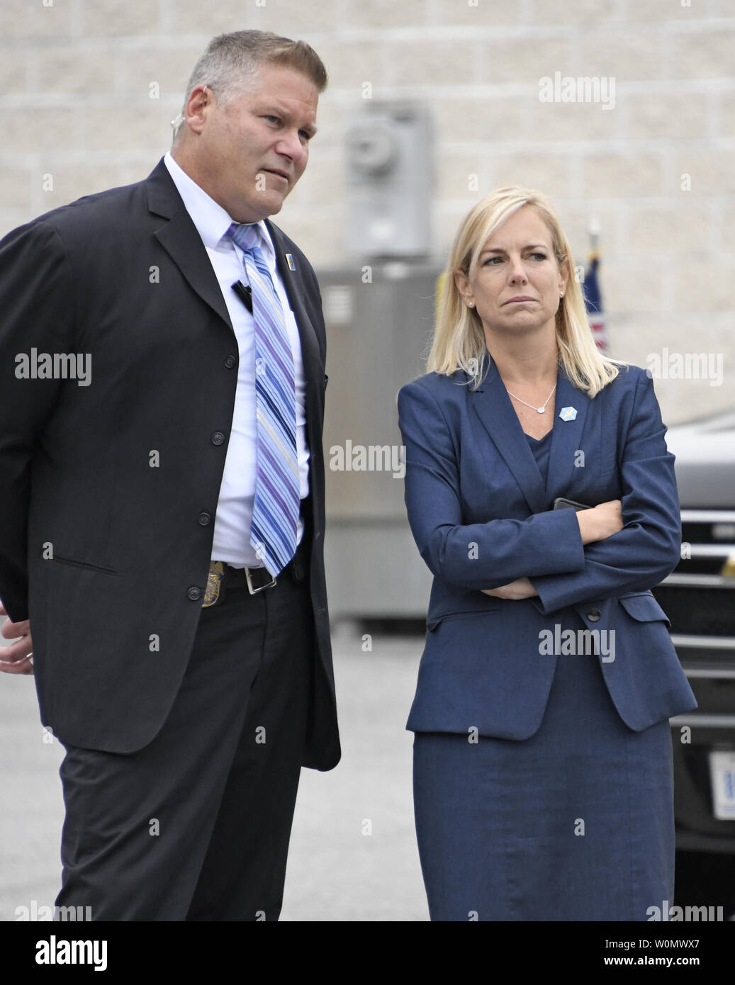 United States Secretary of Homeland Security-designate Kirstjen Nielsen, right, and an unidentified Secret Service agent look on as US President Donald J. Trump tours the US Secret Service James J. Rowley Training Center in Beltsville, Maryland on Friday, October 13, 2017.  Photo by Ron Sachs/UPI Stock Photo