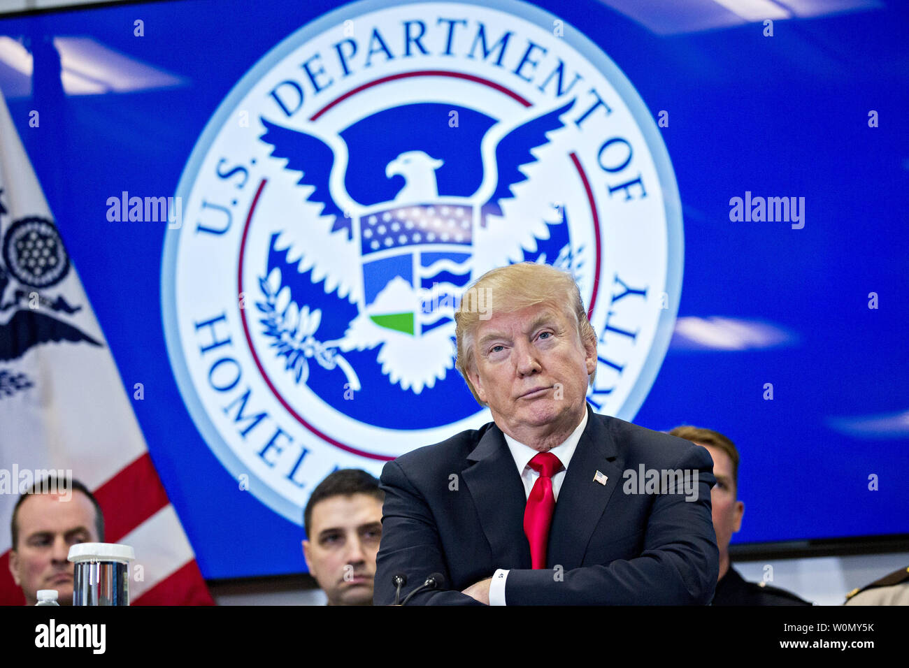 U.S. President Donald Trump listens while participating in a Customs and Border Protection (CBP) roundtable discussion after touring the CBP National Targeting Center in Sterling, Virginia, U.S., on Friday, Feb. 2, 2018. Trump is looking to ratchet up pressure on lawmakers to consider the immigration proposal he unveiled in Tuesday's State of the Union using the visit as an opportunity to again argue his proposal would bolster the country's borders.   Photo by Andrew Harrer/UPI Stock Photo