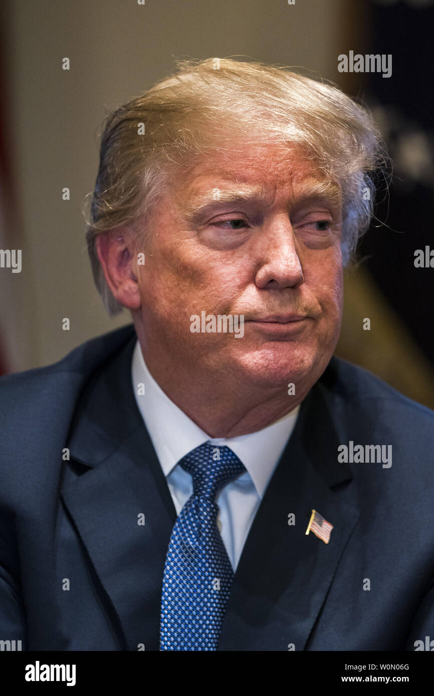 US President Donald J. Trump speaks with the media before a meeting with his military leadership in the Cabinet Room of the White House in Washington DC, on April 9, 2018. Trump said he will decide in the next few days whether the US will respond militarily for the reported chemical weapons attack in Syria. Trump also spoke about the FBI raid of his personal attorney Michael Cohen's office.      Photo by Jim Lo Scalzo/UPI Stock Photo