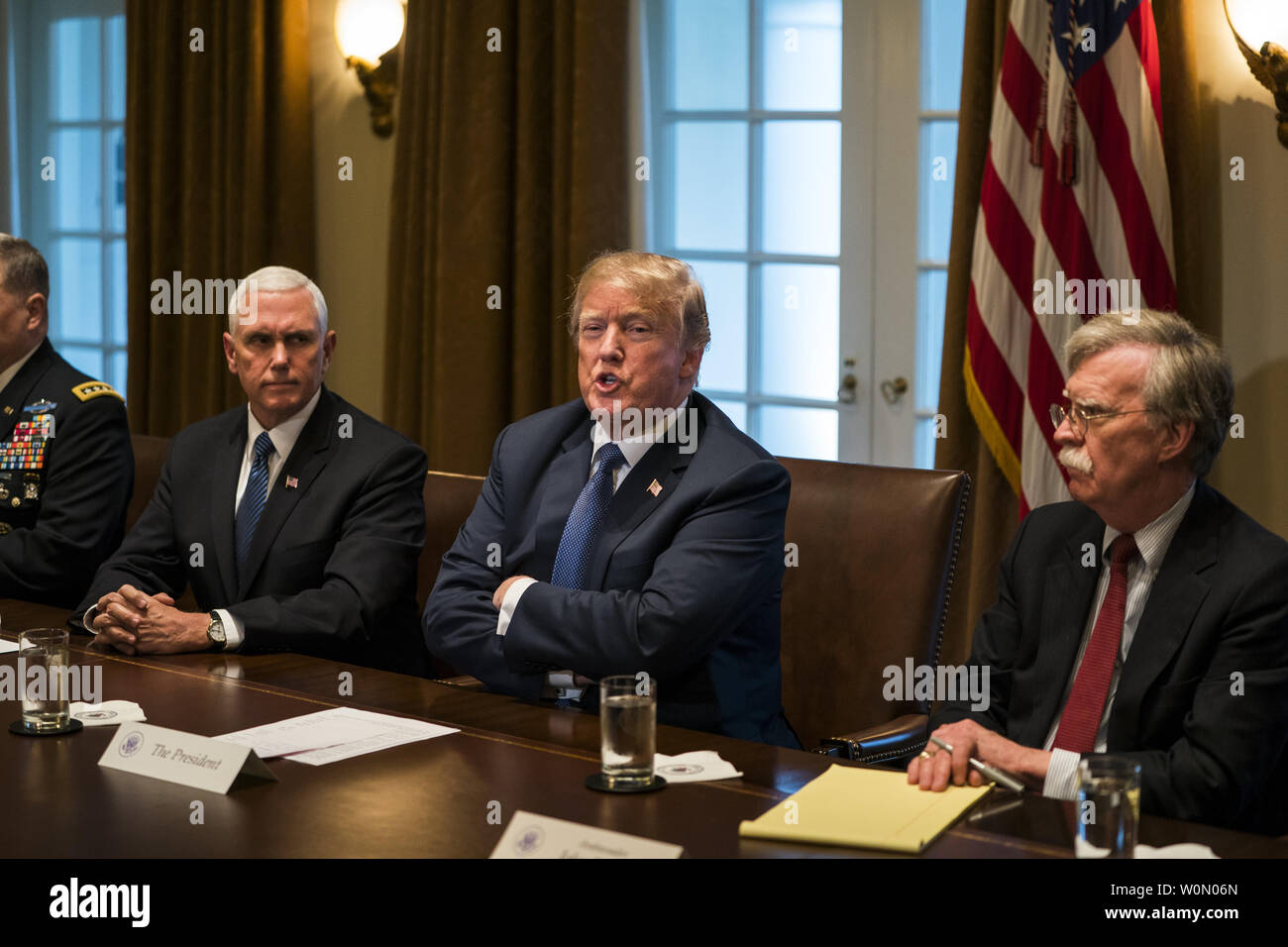 US President Donald J. Trump speaks with the media before a meeting with his military leadership in the Cabinet Room of the White House in Washington DC, on April 9, 2018. Trump said he will decide in the next few days whether the US will respond militarily for the reported chemical weapons attack in Syria. Trump also spoke about the FBI raid of his personal attorney Michael Cohen's office.      Photo by Jim Lo Scalzo/UPI Stock Photo