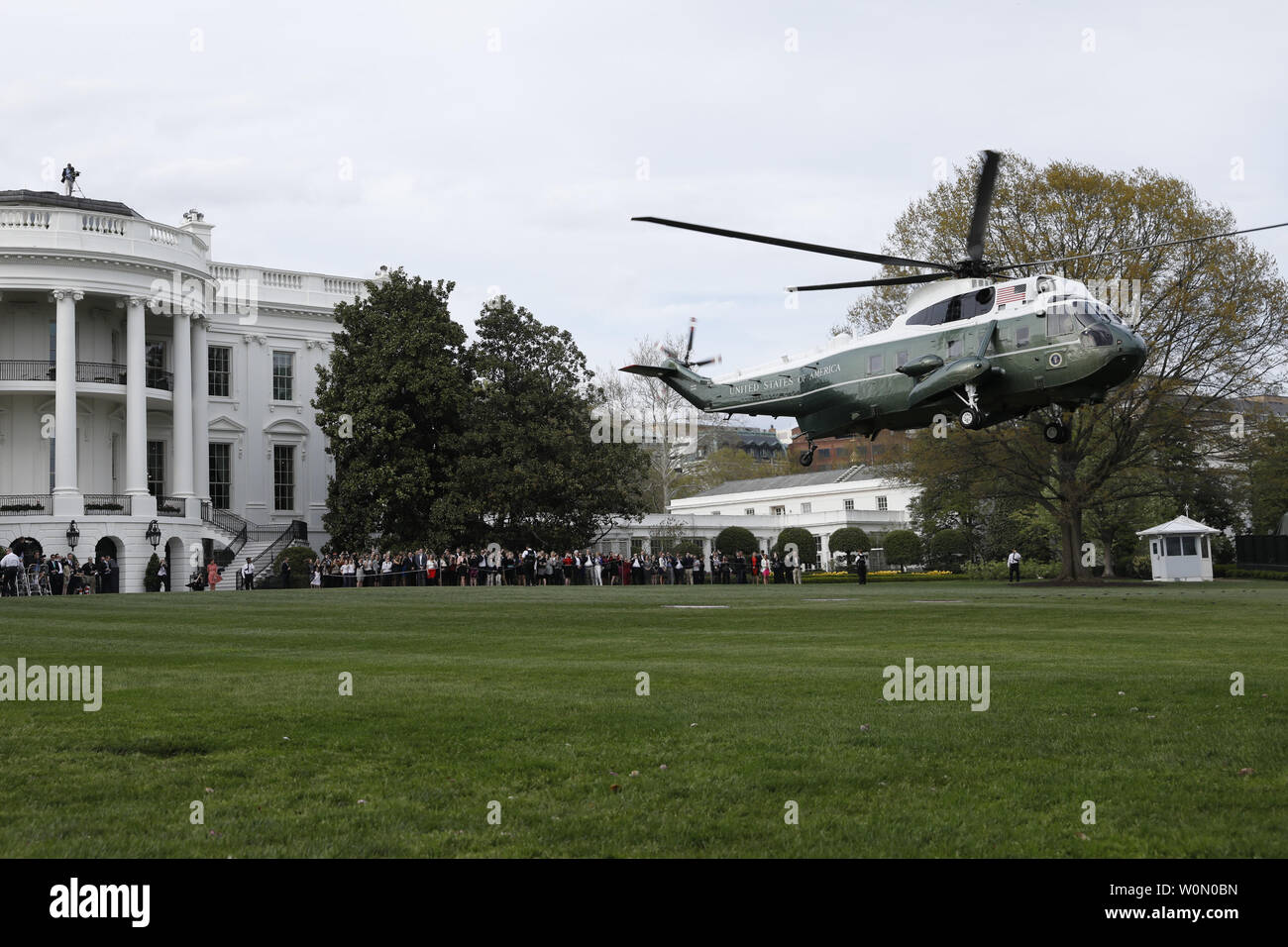 Marine One helicopter with U.S. President Donald Trump, France's President Emmanuel Macron and First Ladies Melania Trump and Brigitte Macron on board departs on the South Lawn of the White House in Washington, DC on April 23, 2018. As Macron arrives for his first state visit of Trump's presidency, the U.S. leader is threatening to upend the global trading system with tariffs on China, maybe Europe too.       Photo by Yuri Gripas/UPI Stock Photo