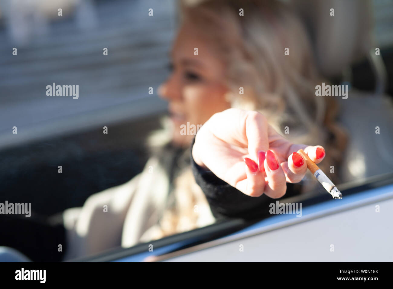 Red nails cigarette hires stock photography and images Alamy