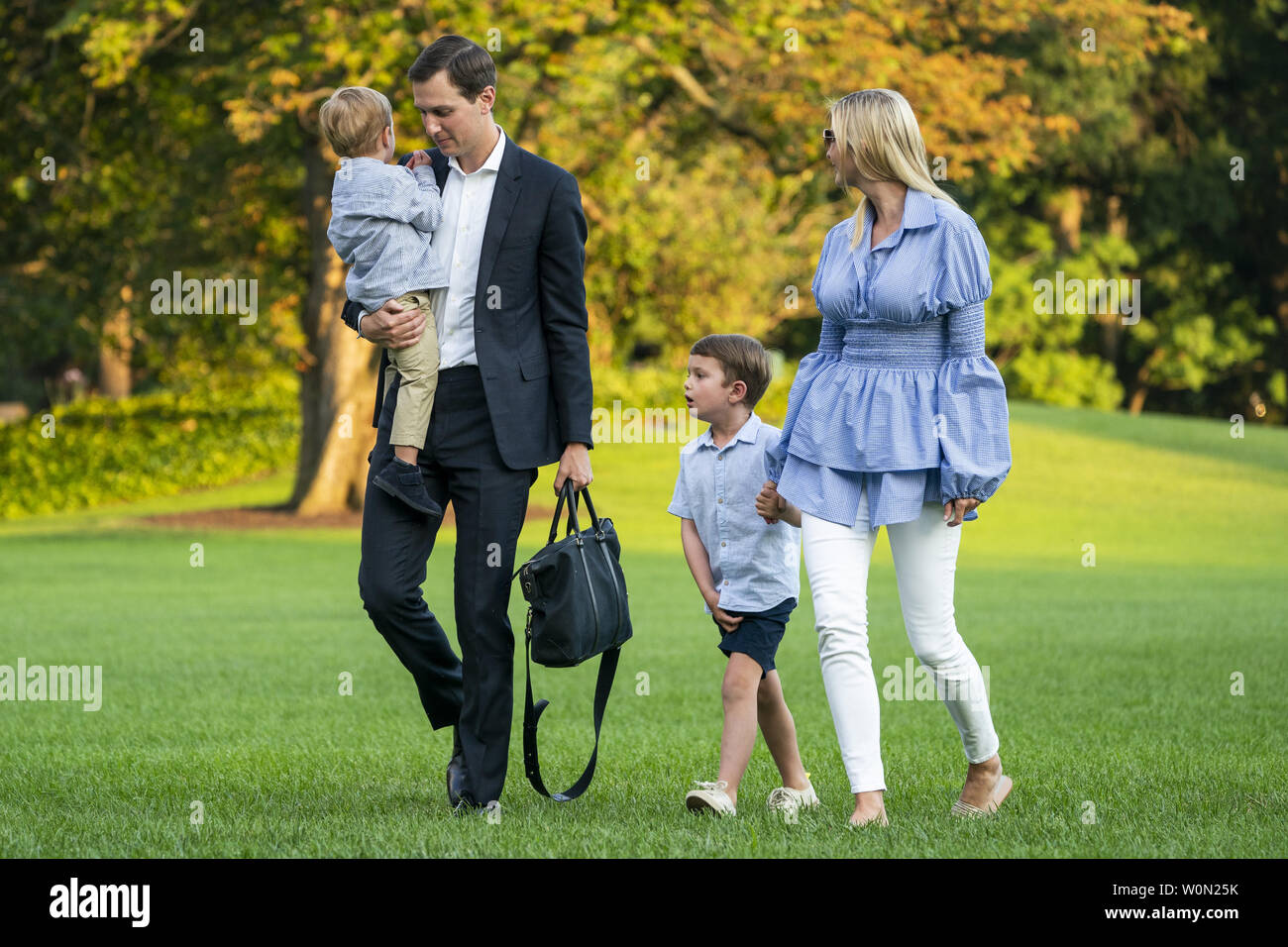 Jared Kushner (C-L) and Ivanka Trump (R) walk with their children Theodore (L) and Joseph (C-R) across the South Lawn as they return from a weekend stay in Bedminster, New Jersey at the White House in Washington, DC on July 29, 2018. Earlier in the day, the U.S. President Donald J. Trump once again went after the media on Twitter, calling them the 'enemy of the people.'   Photo by Jim Lo Scalzo/UPI Stock Photo